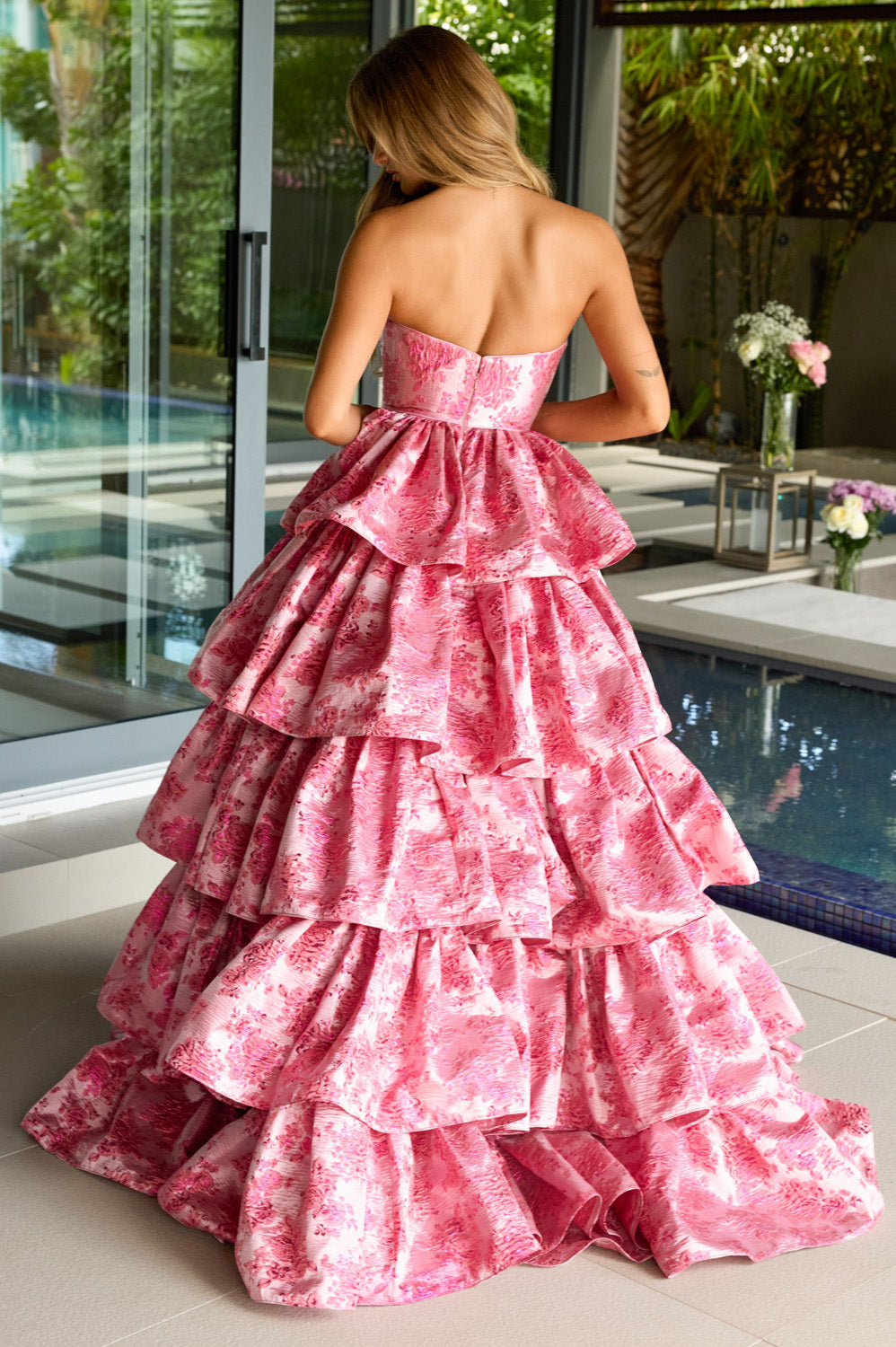 Ava Presley 26412 Hot pink tiered ballgown with a strapless design and ruffled layers, back view prom dress.