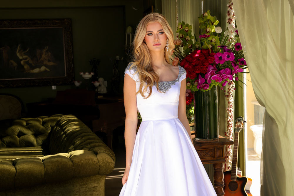 Ava Presley 39322 prom dress images. Ava Presley 39322 is available in these colors: White, Sky Blue, Orchid, Red.