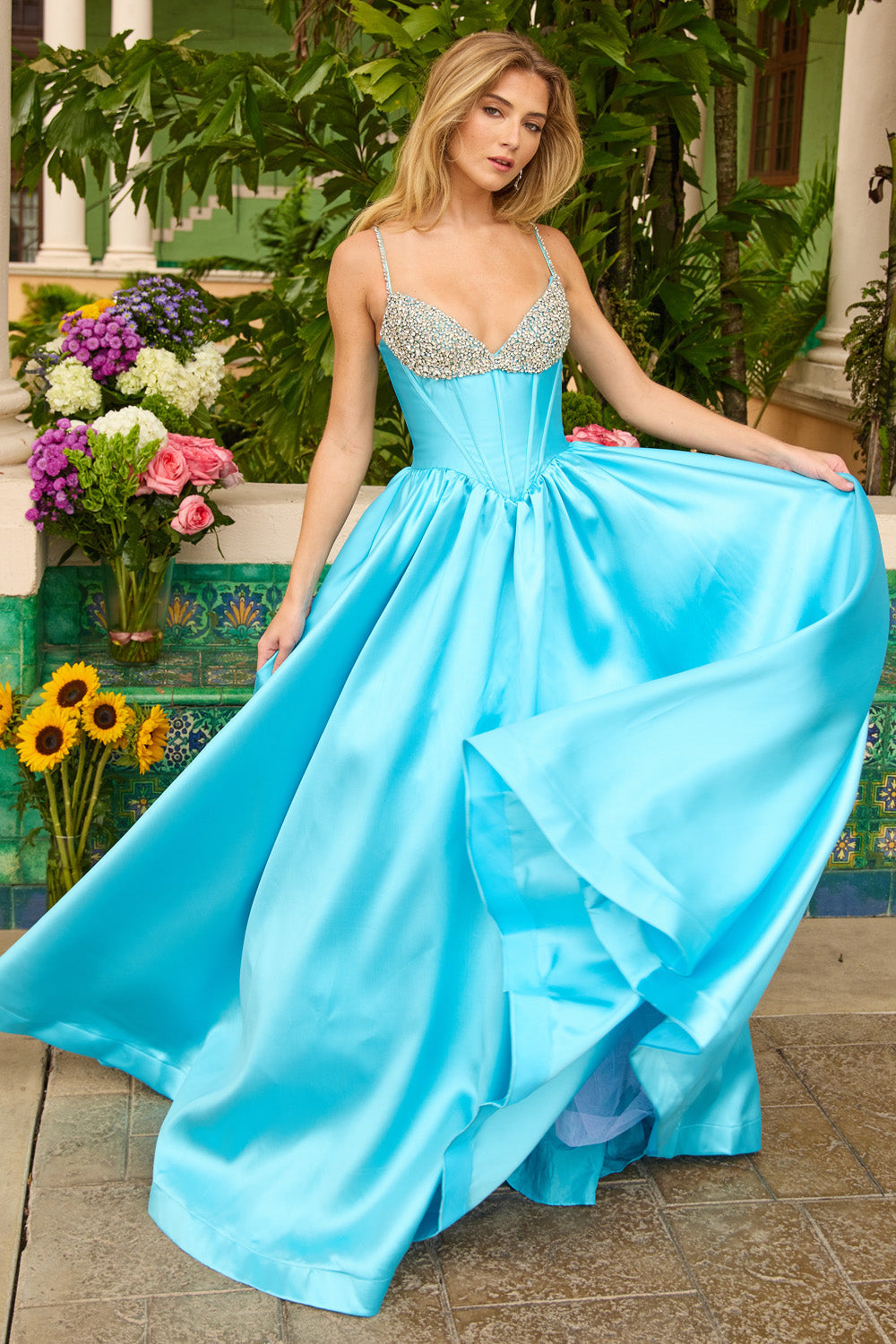 Ava Presley 42311 Turquoise A-line prom dress with beaded bodice and flowing skirt.