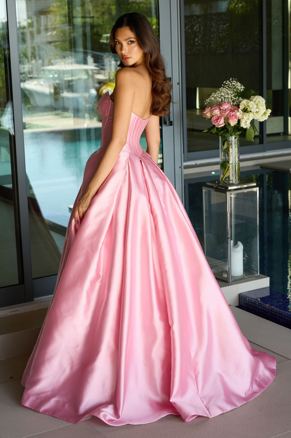 Ava Presley 47223 Blush ballgown prom dress with a corset back, shown from the back view.