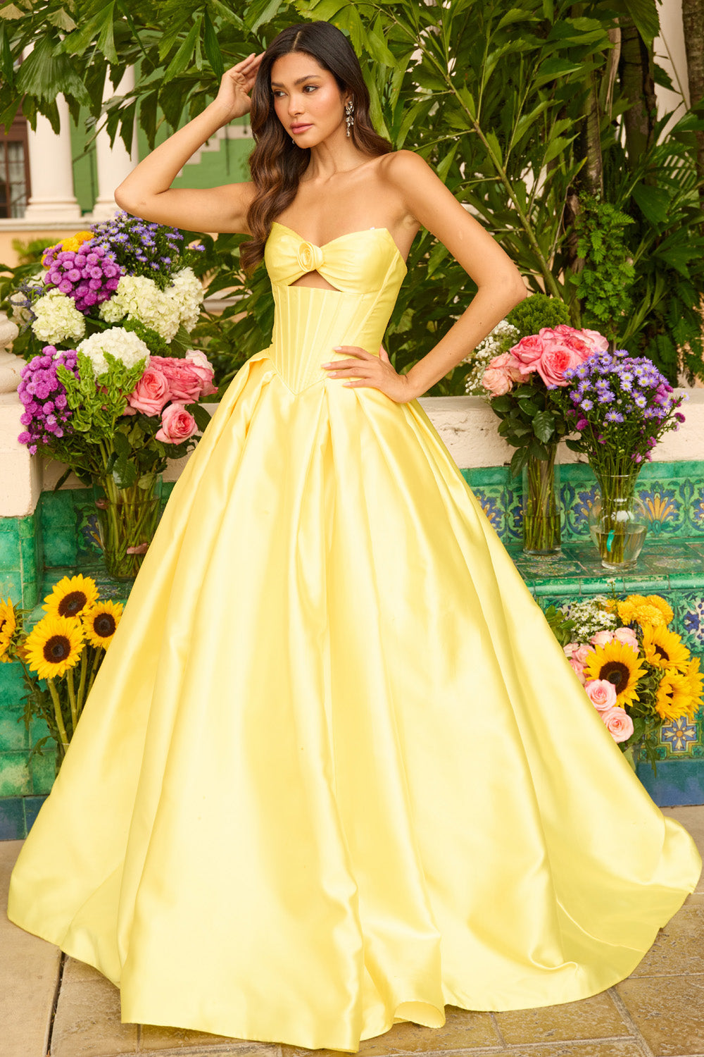 Ava Presley 47223 Yellow A-line prom dress with a bow detail and pleated bodice, front view.