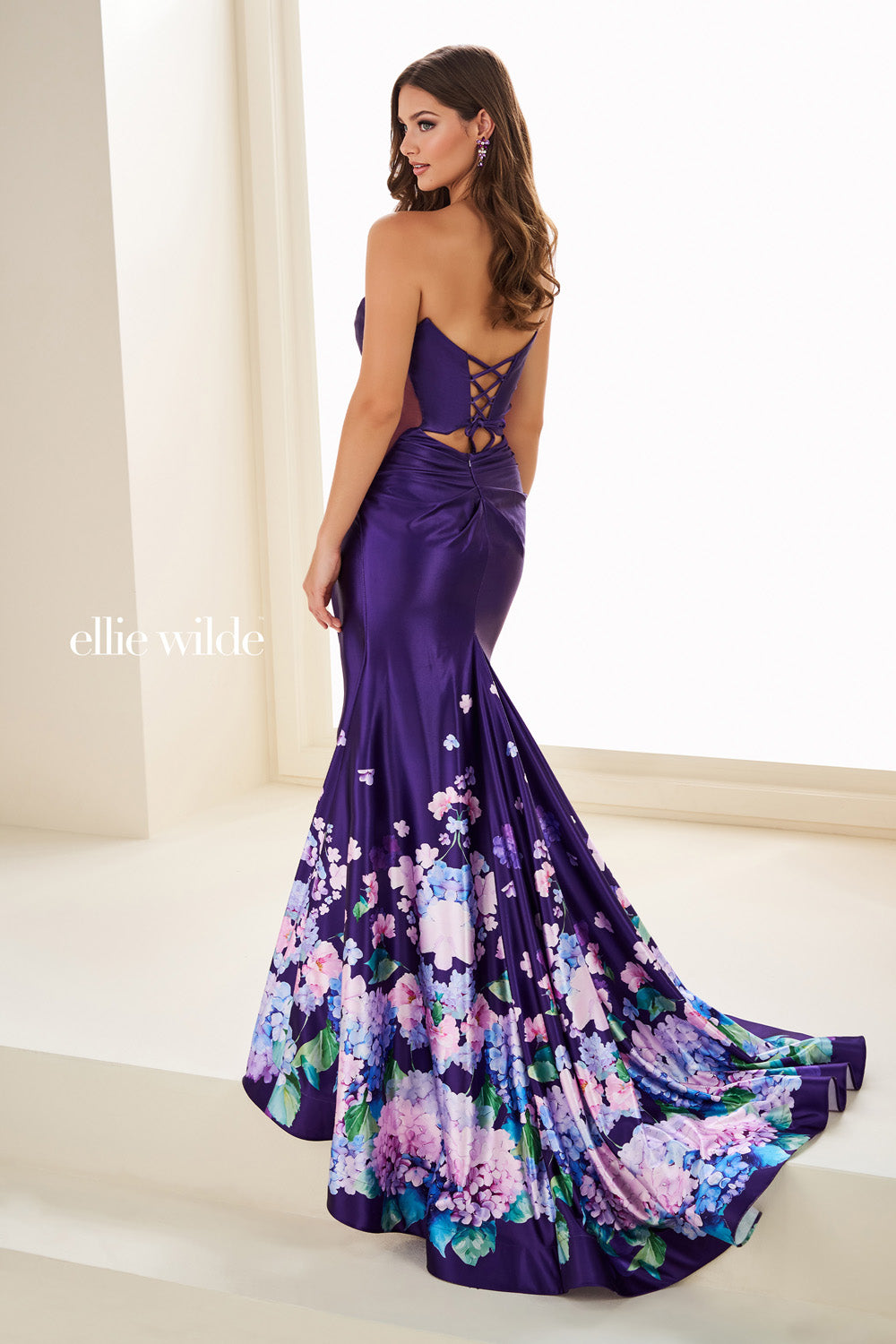 Ellie Wilde EW37002 purple mermaid dress with floral print and lace up back prom dress images.