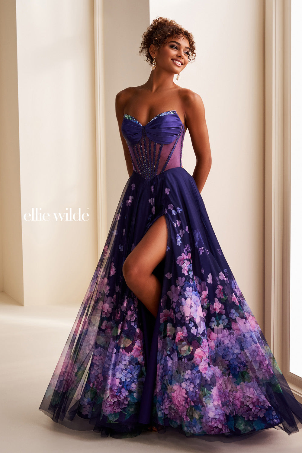 Ellie Wilde EW37003 purple gown with floral print and high slit prom dress images.
