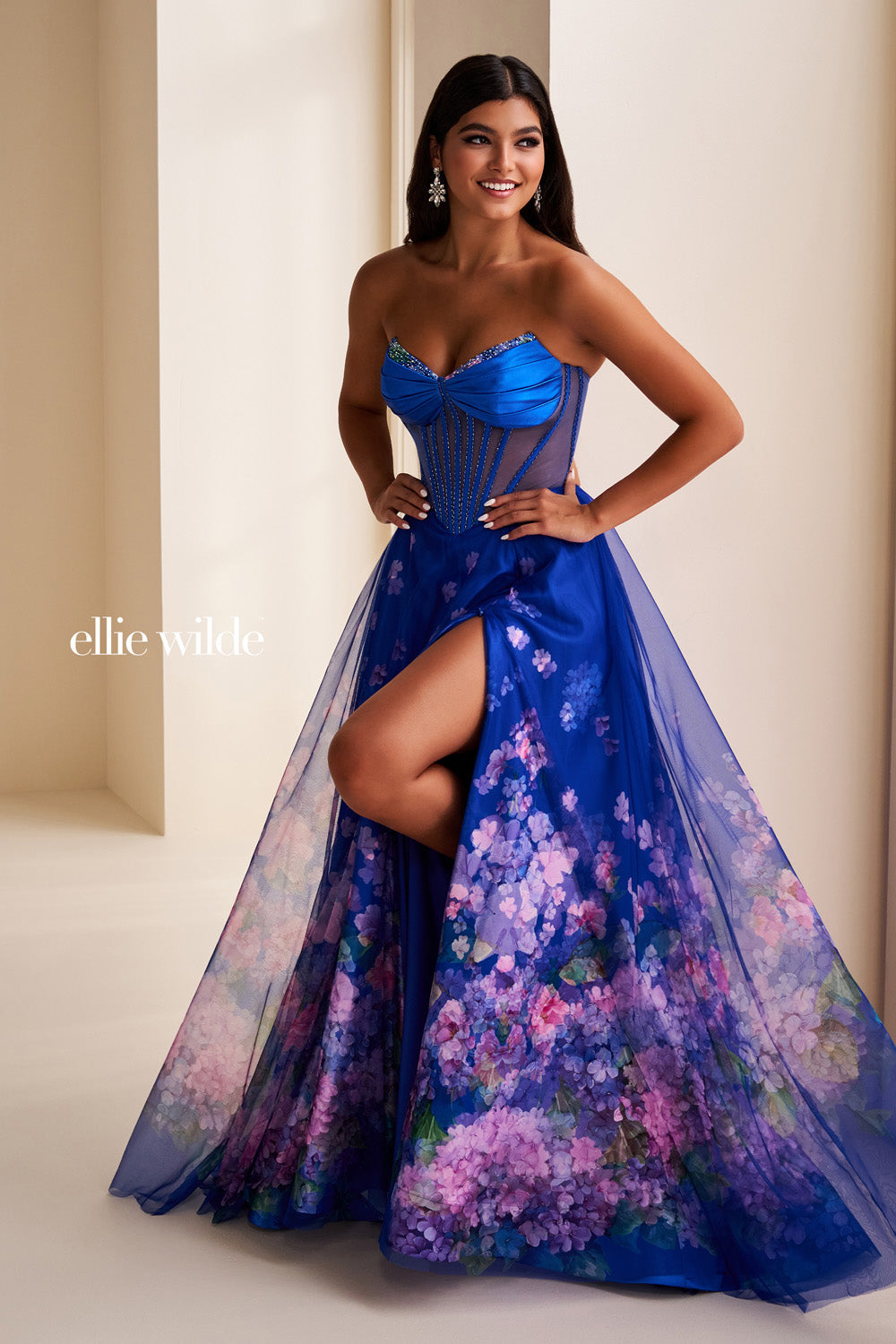 Ellie Wilde EW37003 blue gown with floral overlay and high slit prom dress images.