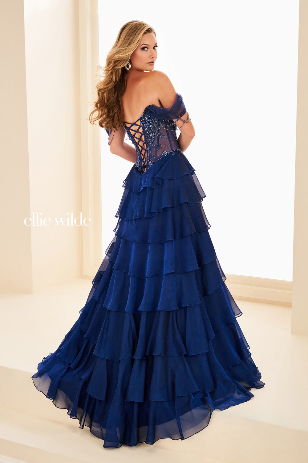 Ellie Wilde EW37018 blue, tiered silhouette with lace up back detail prom dress images.