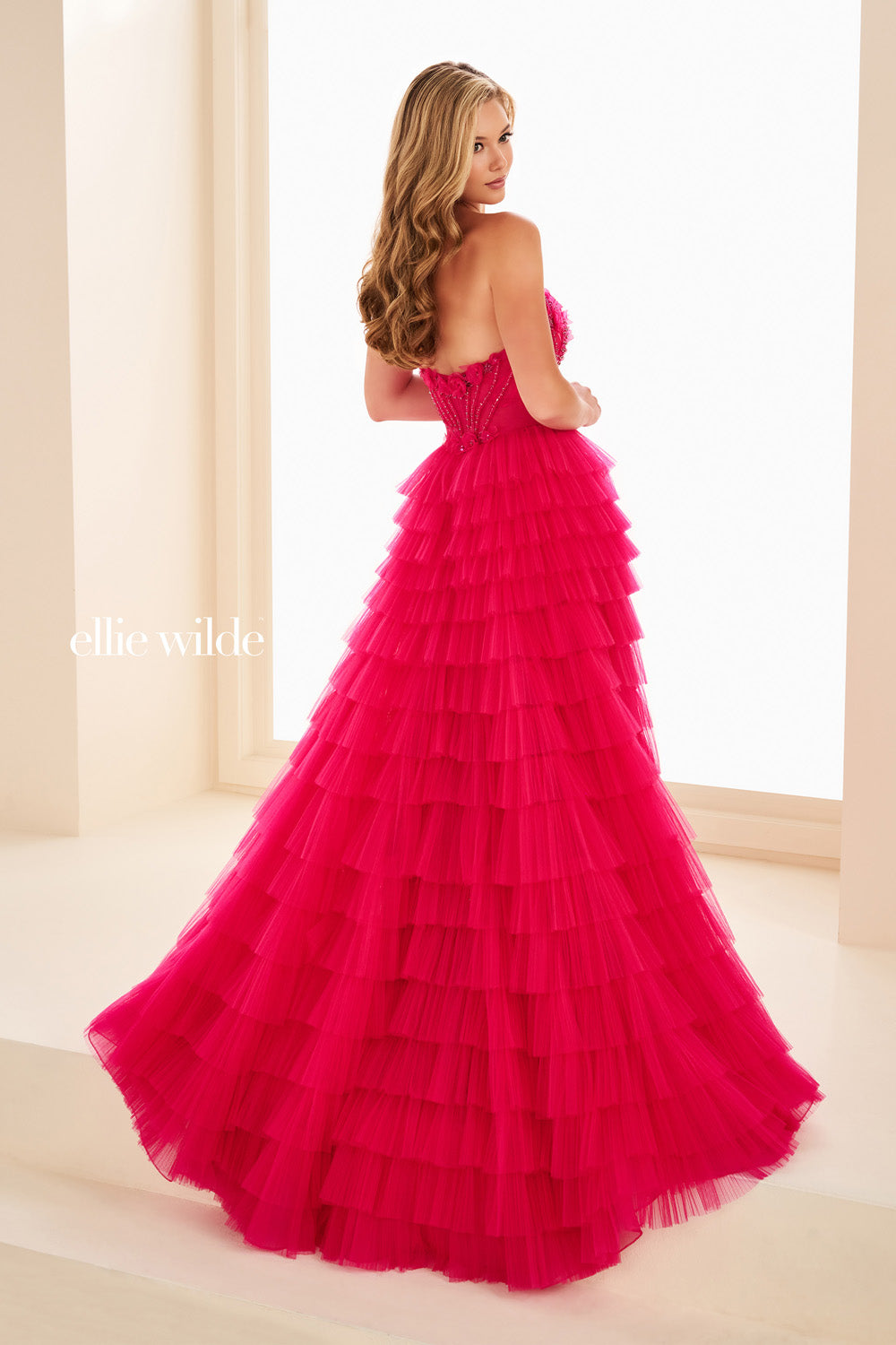 Ellie Wilde EW37026 bright pink, tiered silhouette, strapless design prom dress images.