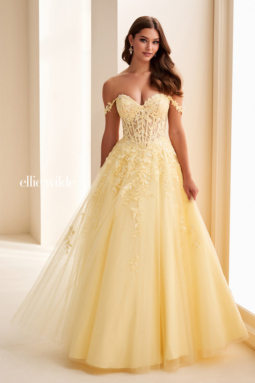 Ellie Wilde EW37028 yellow ball gown with off the shoulder neckline and floral details prom dress images.