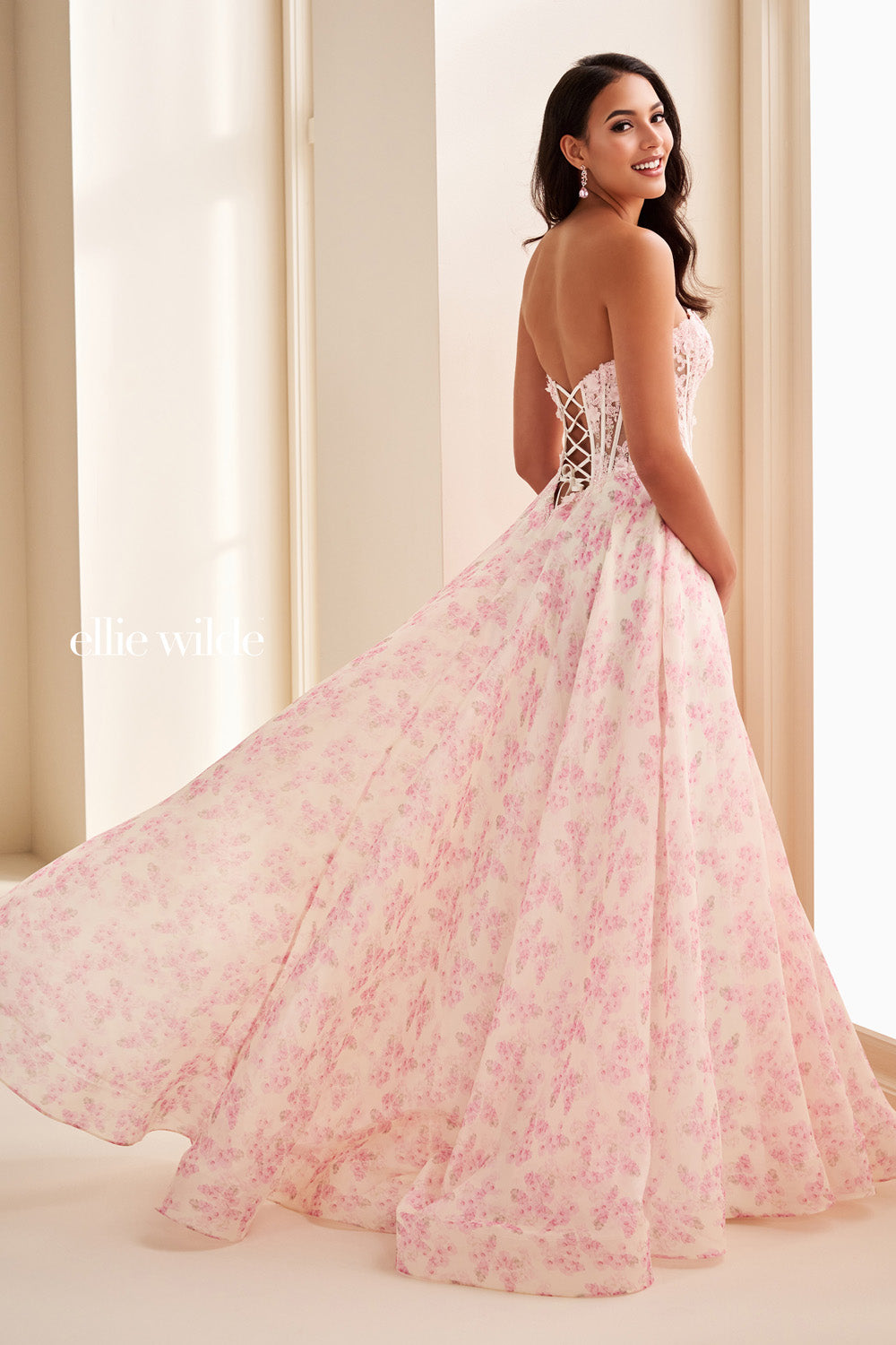Ellie Wilde EW37091 pink floral gown with a flowing a line silhouette prom dress images.