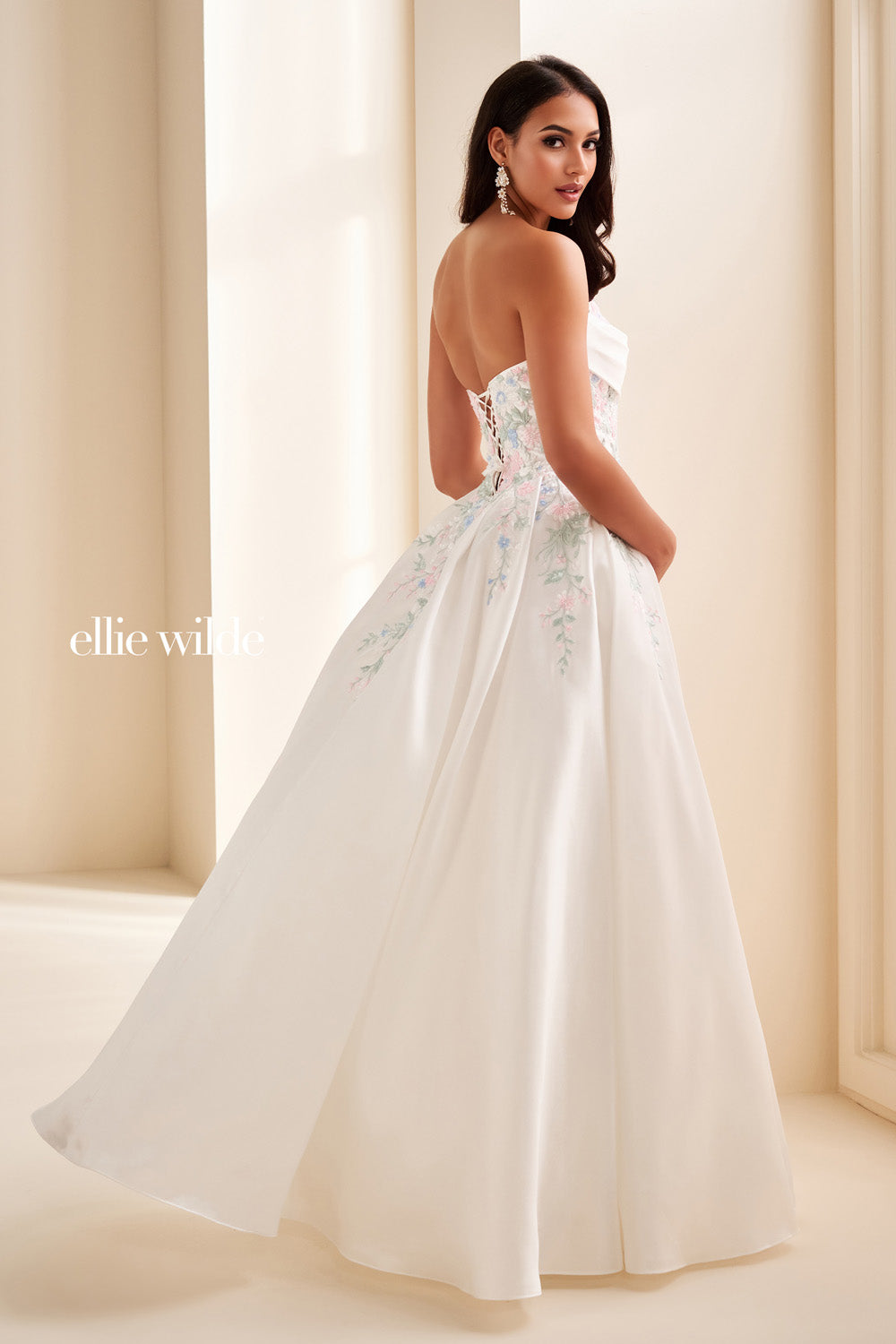 Ellie Wilde EW37095 white strapless gown with floral embroidery and pockets prom dress images.