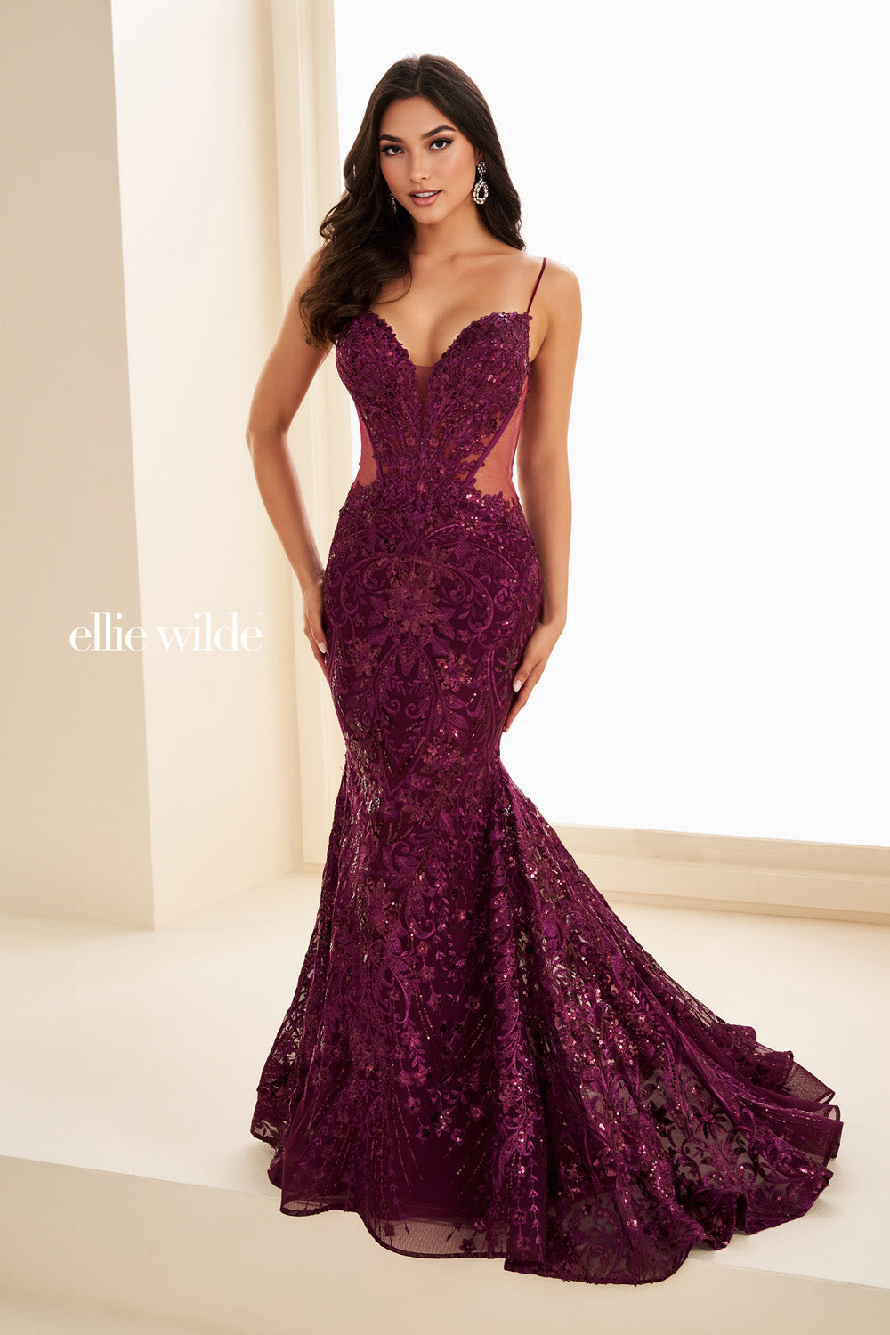 Ellie Wilde EW37227 purple mermaid dress with intricate beading and cutouts prom dress images.