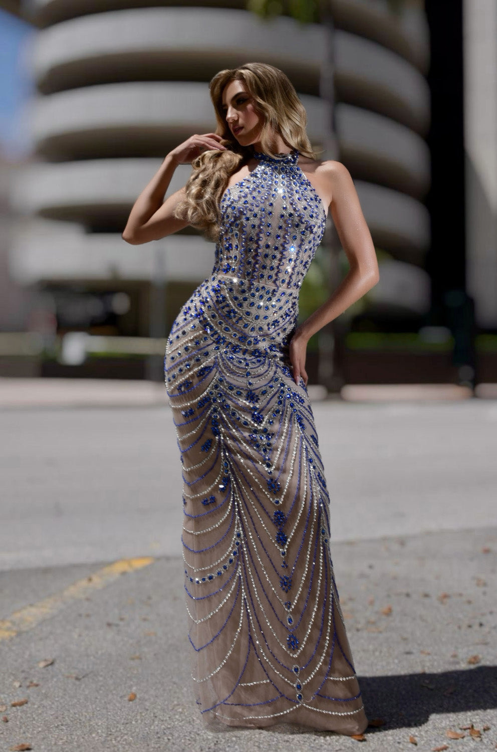 Jasz Couture 7912 Nude blue mermaid prom dress with intricate beading, front view.