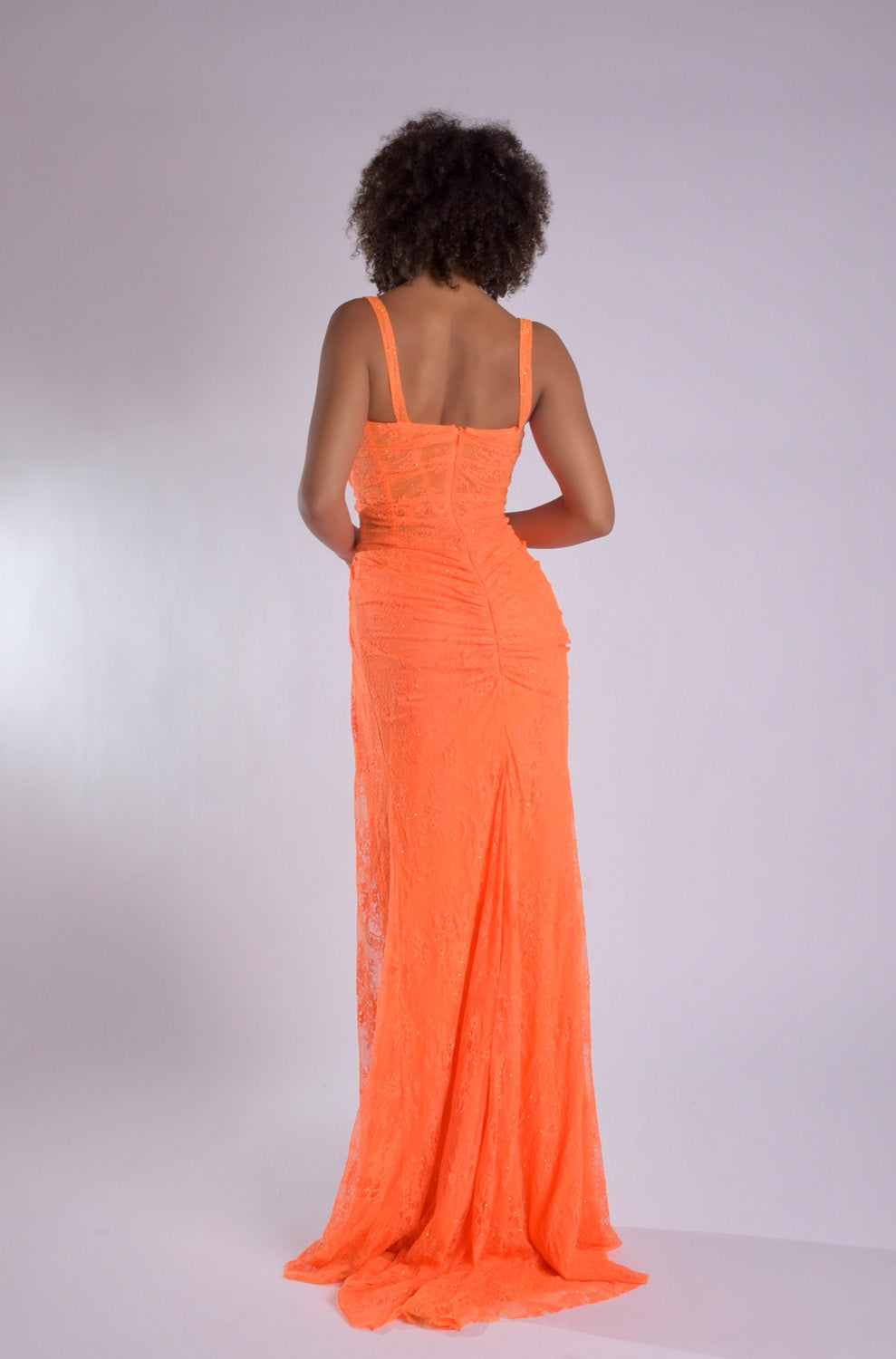 Jasz Couture 7913 Orange fitted prom dress with lace-up back and elegant train, back view.