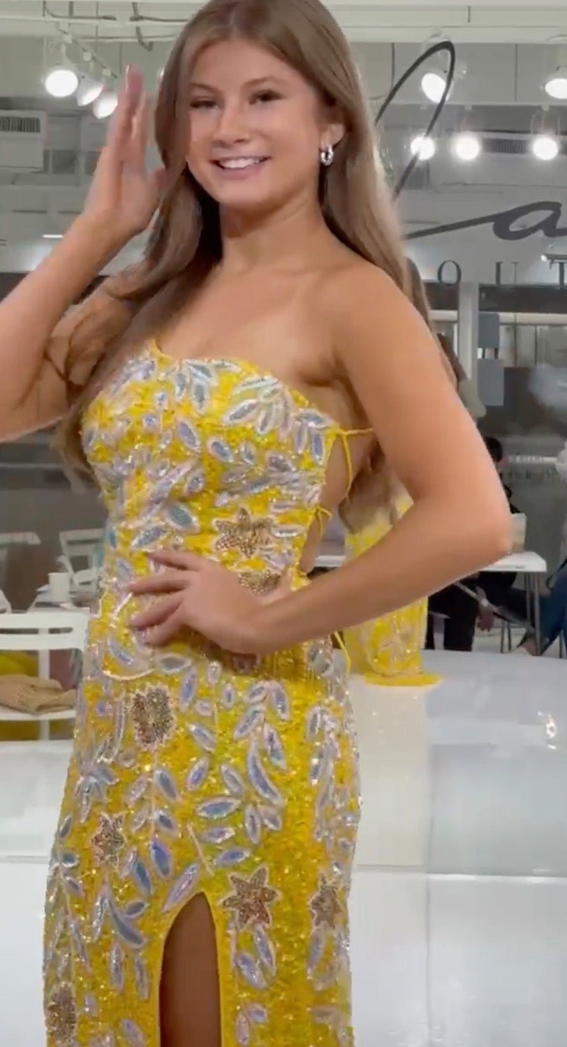 Jasz Couture 7928 Yellow fitted prom dress with intricate beading and a thigh-high slit, side view.
