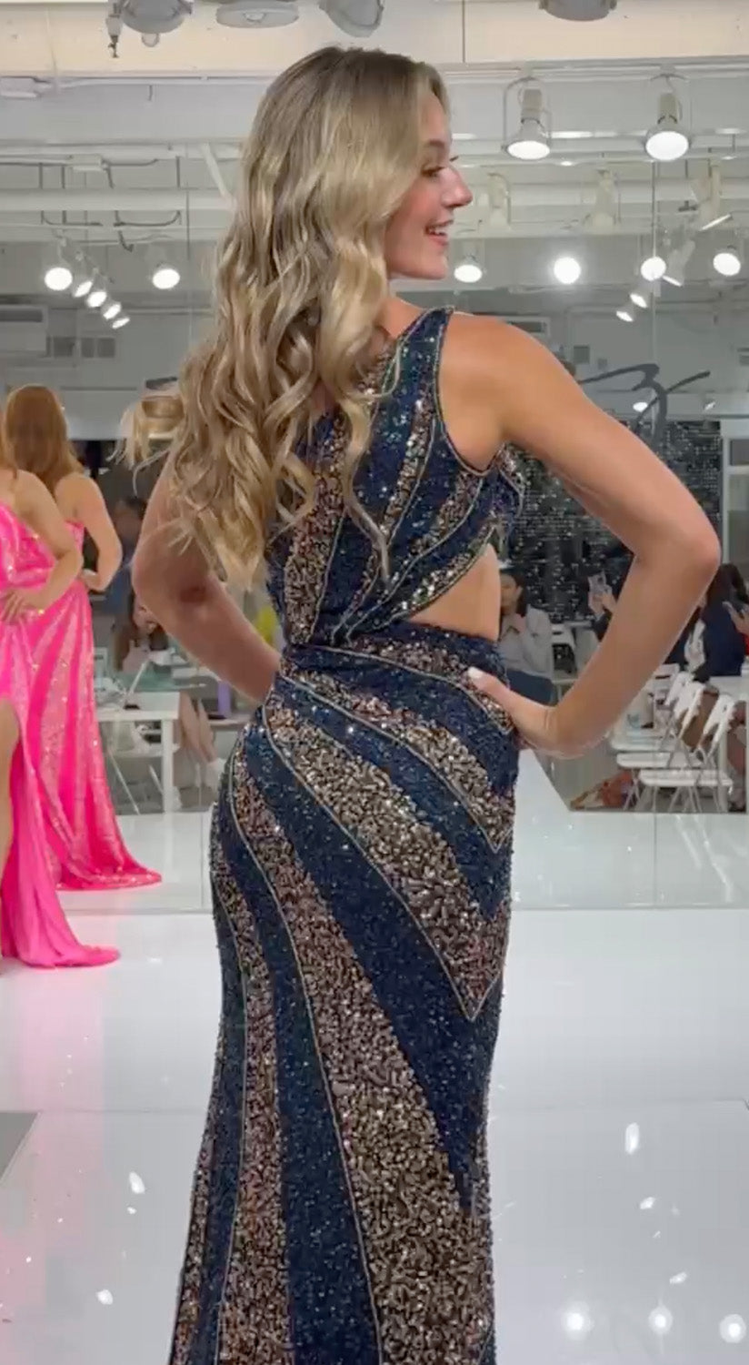 Jasz Couture 7929 Navy gold mermaid prom dress with stunning beading and open back view.