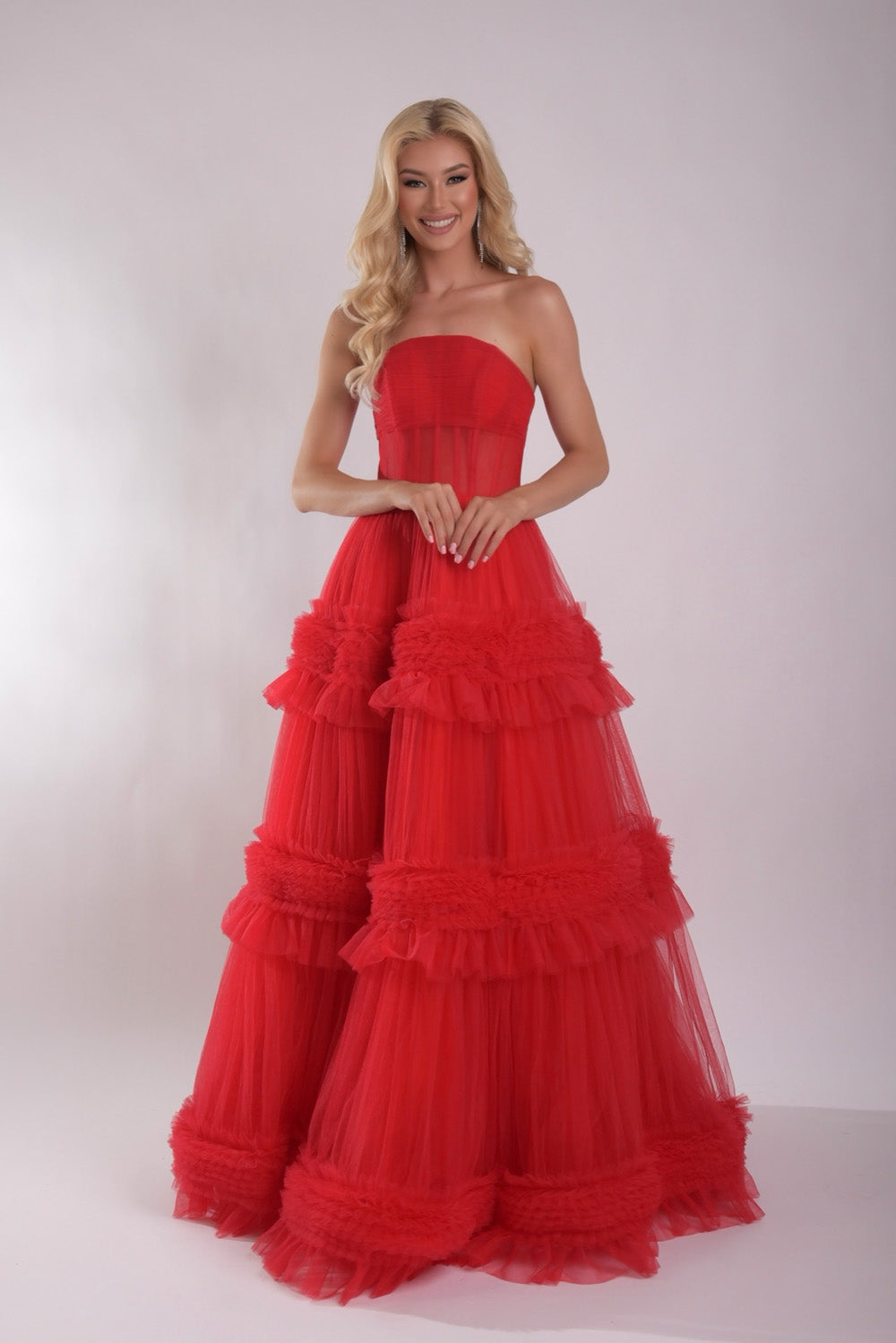 Jasz Couture 7930 Red strapless ballgown with layered ruffles and a fitted bodice, front view prom dress.