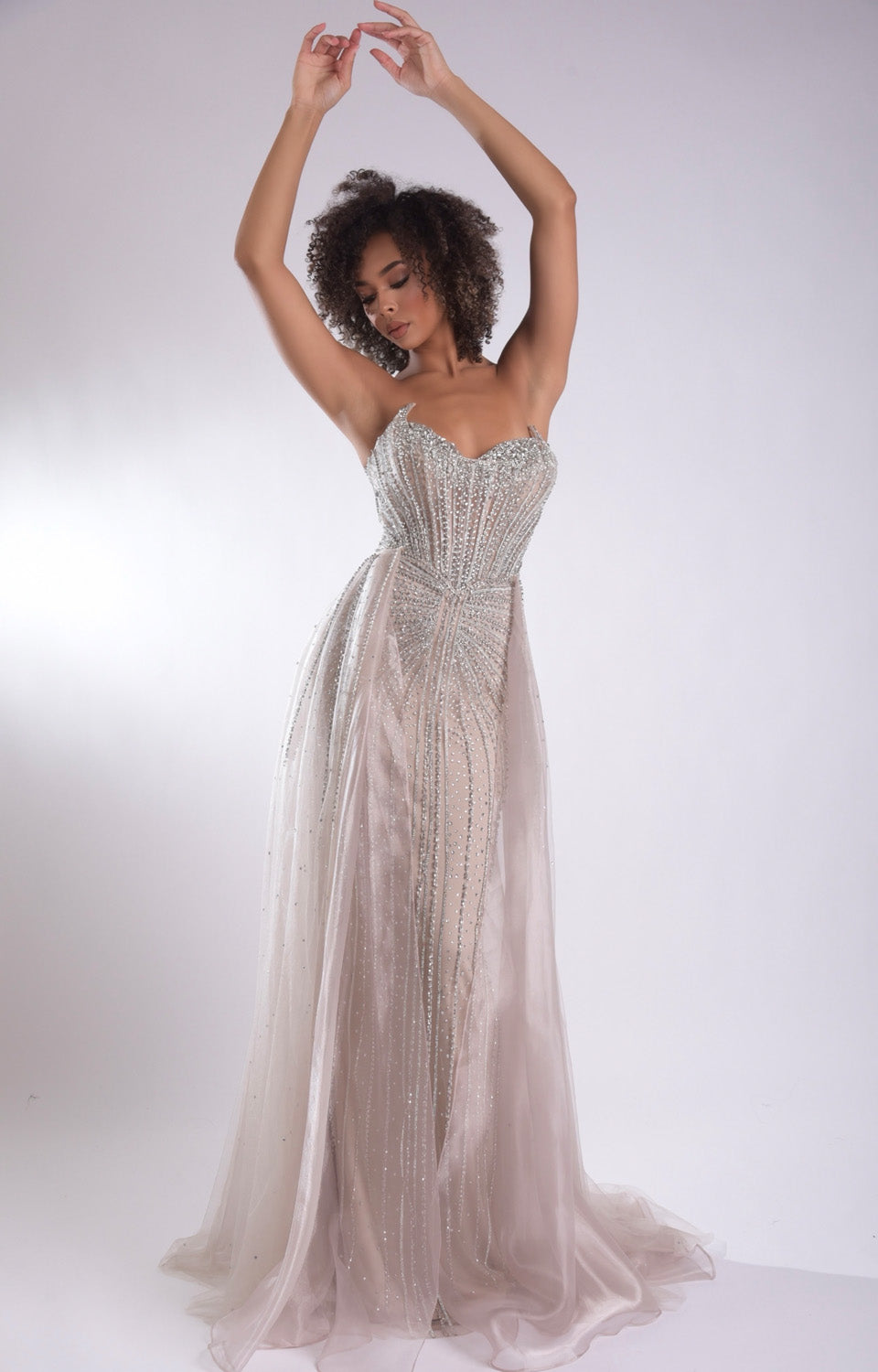 Jasz Couture 7932 Champagne formal gown with fitted silhouette and stunning beading, front view.