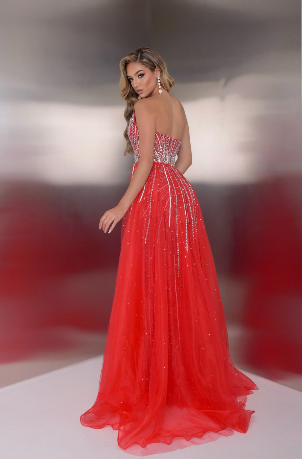 Jasz Couture 7932 Red mermaid prom dress with sparkling beading and a stunning back view.