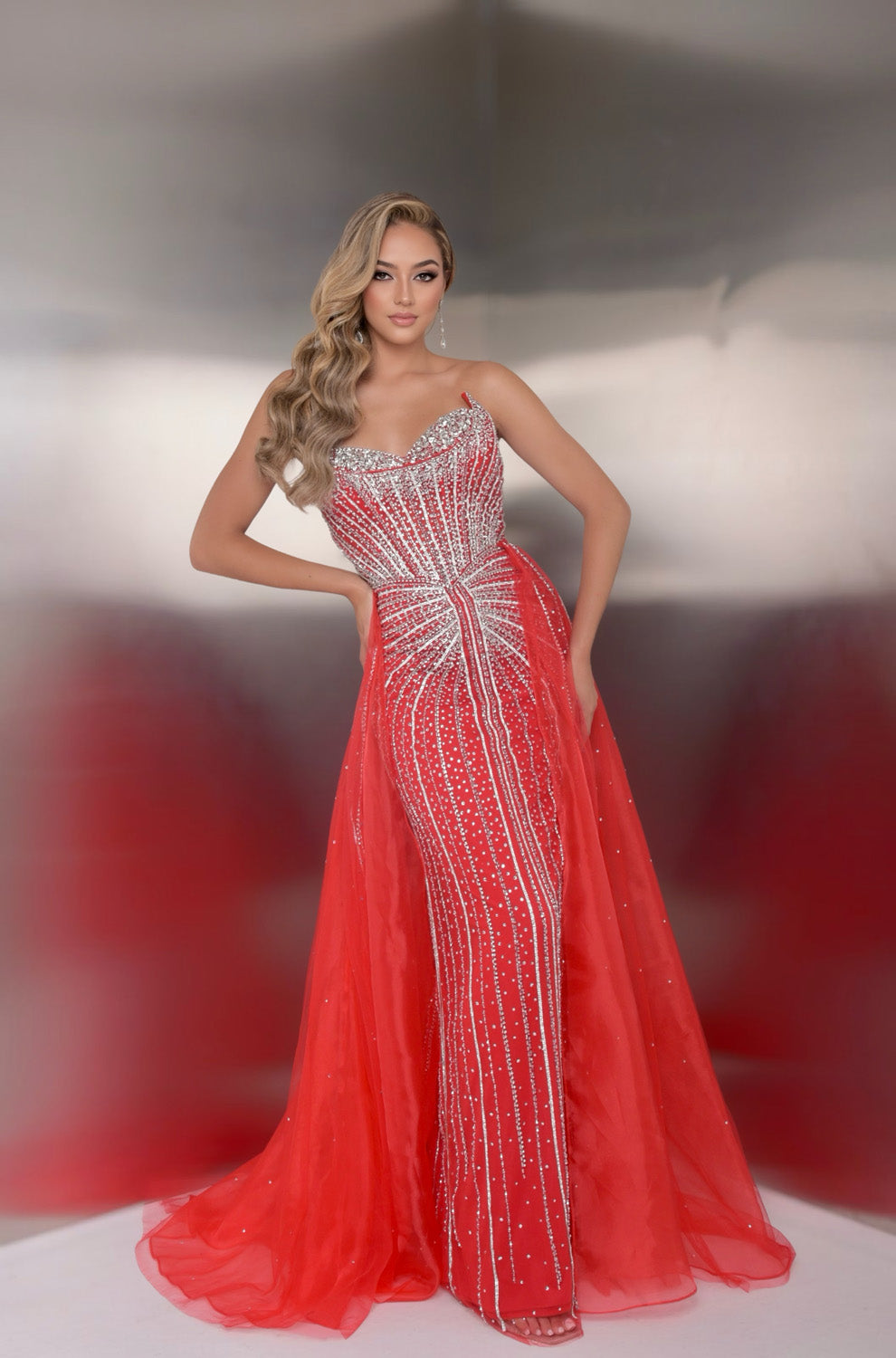 Jasz Couture 7932 Red fitted prom dress with sparkling beading and a dramatic side slit, front view.