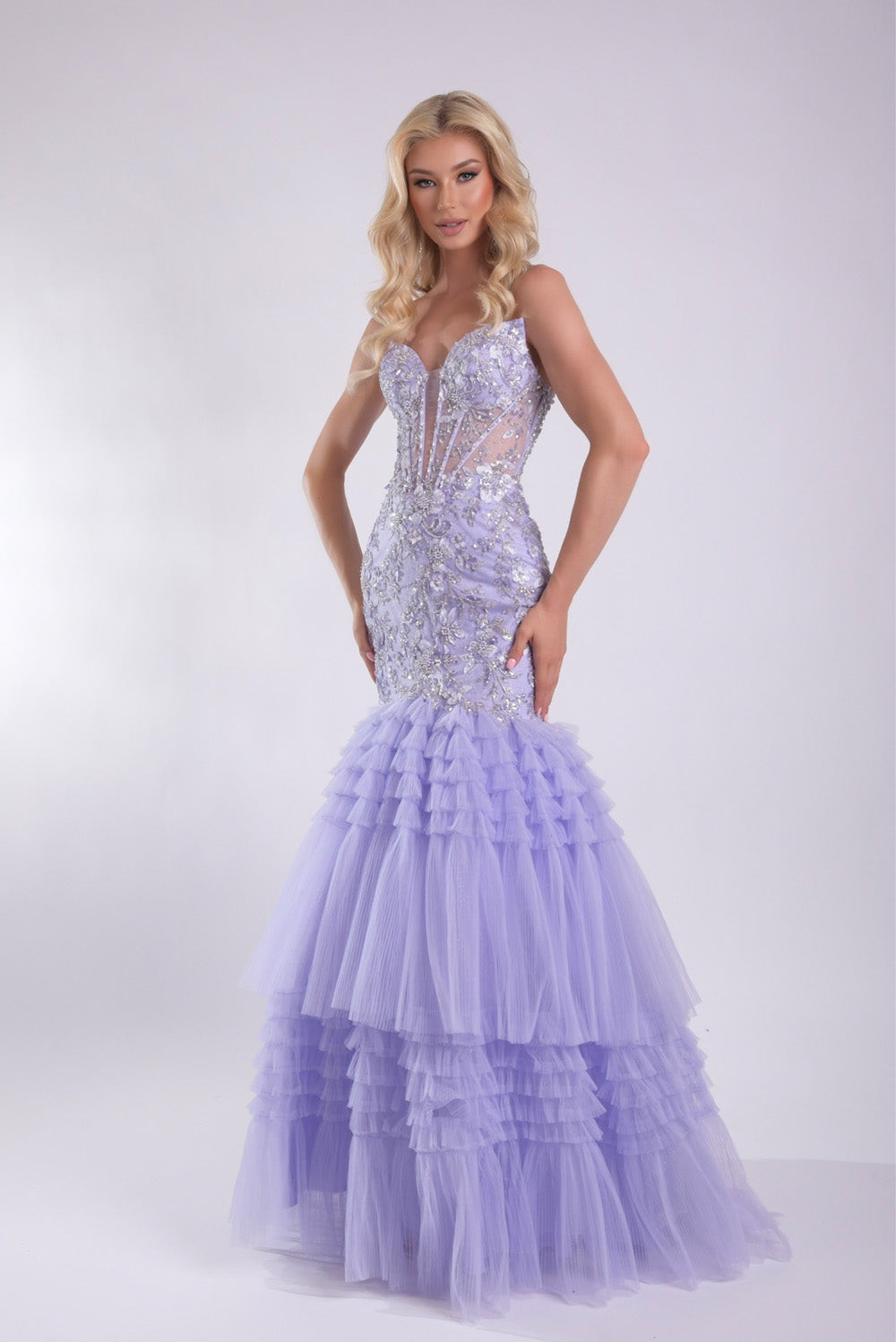 Jasz Couture 7939 Lilac mermaid prom dress with intricate beading and layered tulle ruffles.