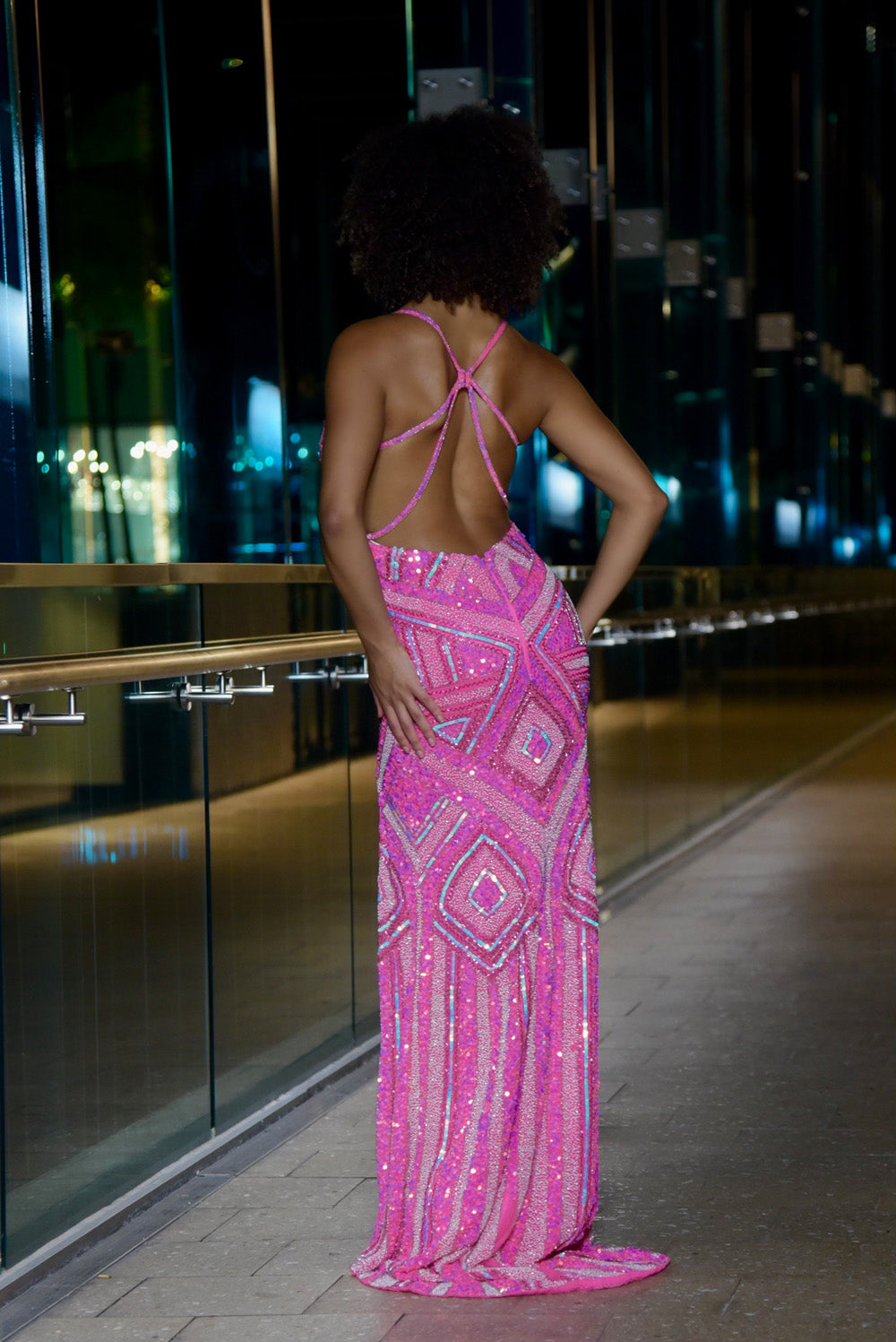 Jasz Couture 7950 Hot pink mermaid prom dress with a stunning lace-up back and sequined design, back view.