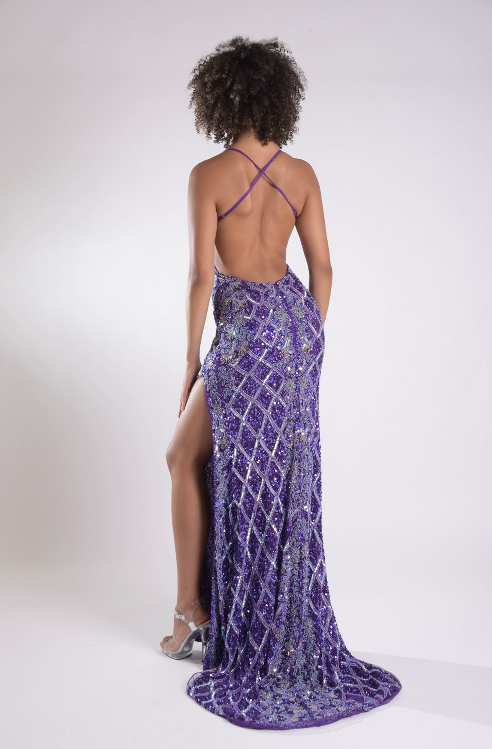 Jasz Couture 7953 Purple mermaid prom dress with a high slit and crisscross back design.