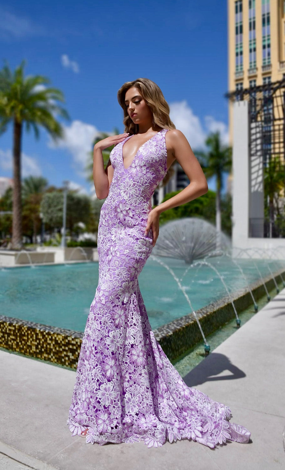 Jasz Couture 7955 Lilac mermaid prom dress with intricate lace detailing and a plunging neckline.