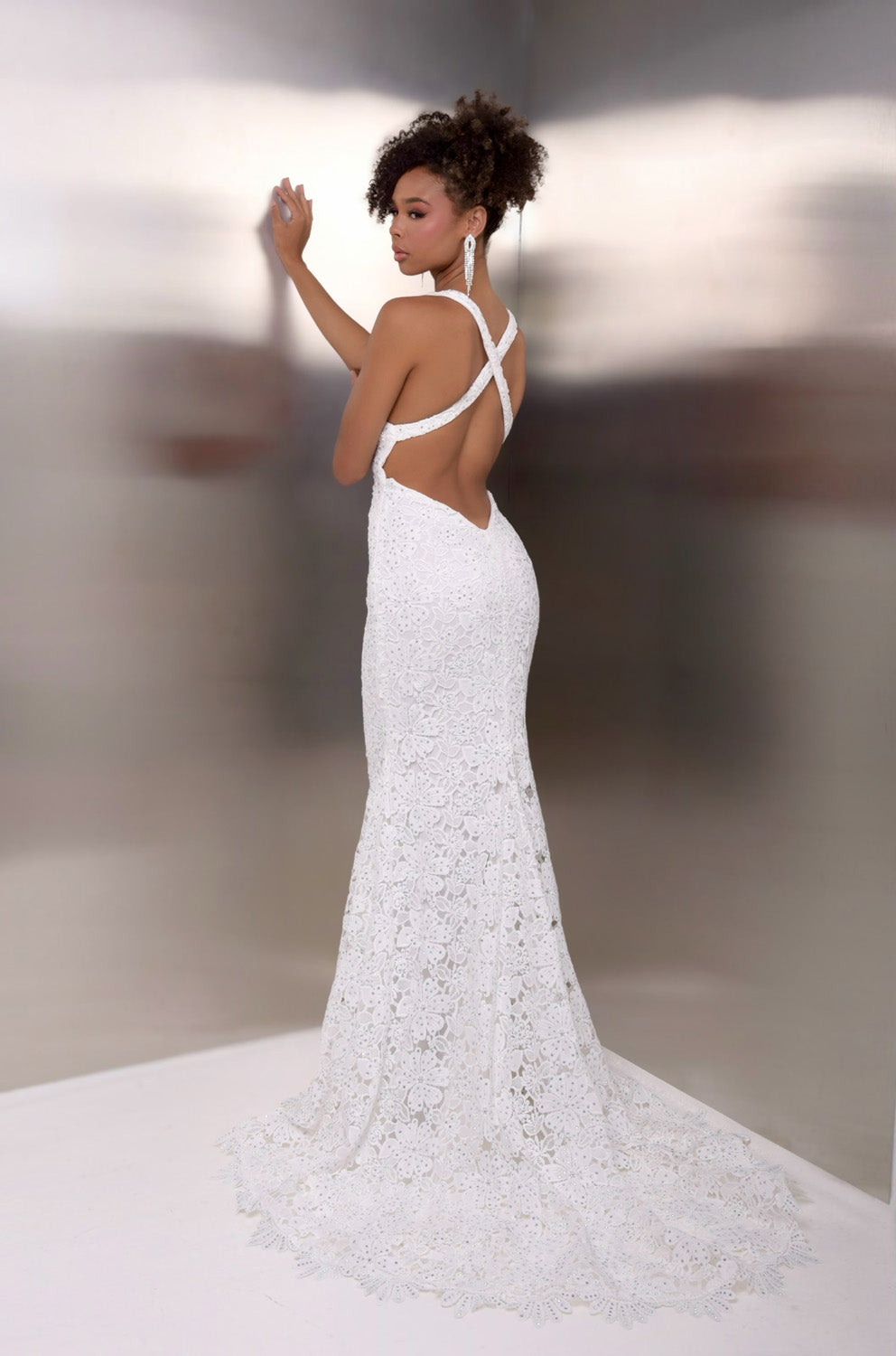 Jasz Couture 7955 White lace mermaid prom dress with a stunning open back and intricate detailing.