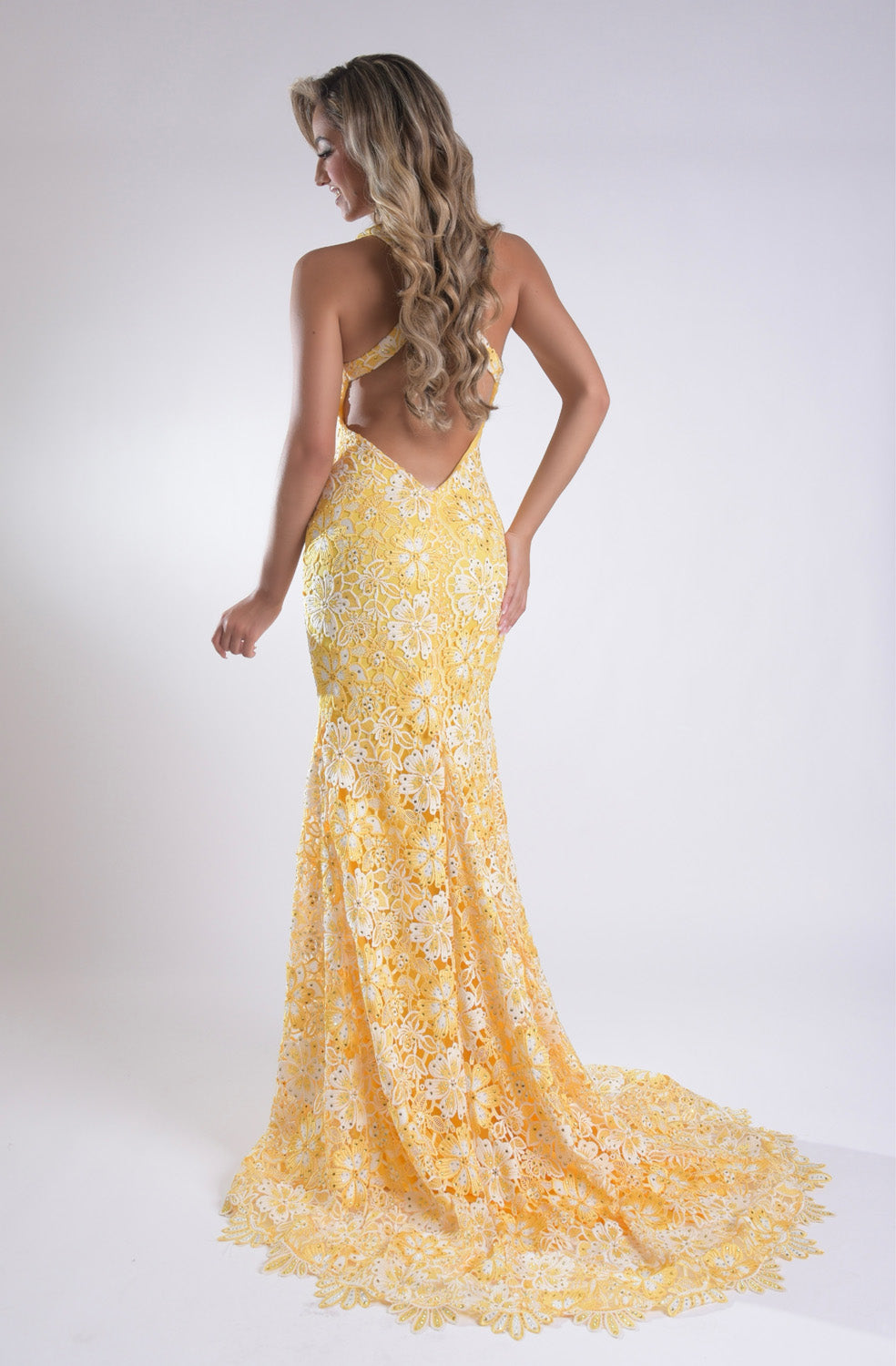Jasz Couture 7955 Yellow lace mermaid prom dress with a stunning open back design.
