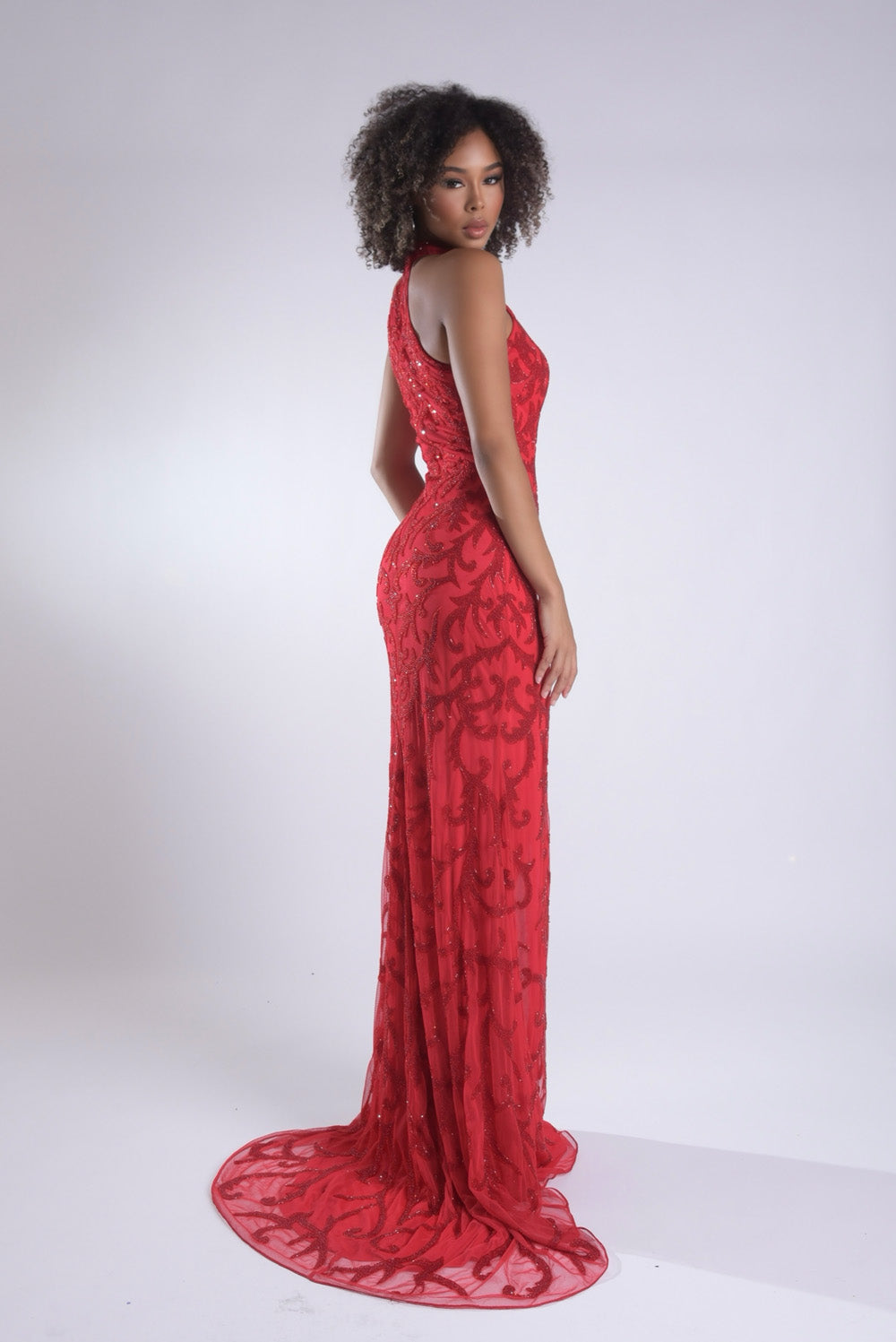 Jasz Couture 7956 Red mermaid prom dress with intricate lace detailing and a stunning back view.