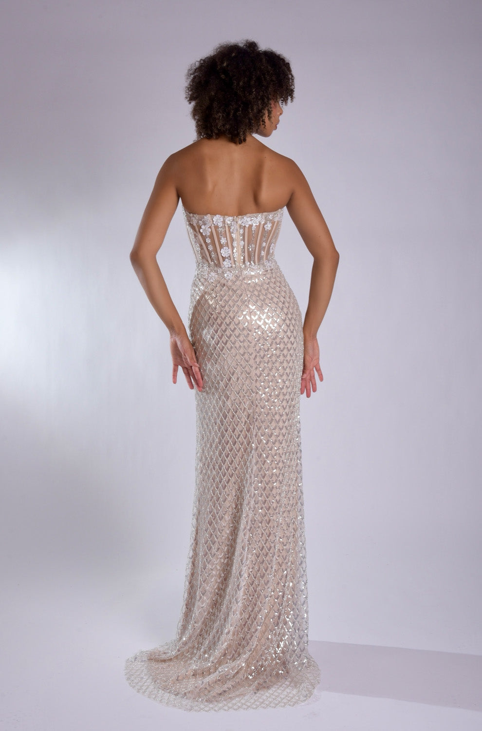 Jasz Couture 7957 Nude white mermaid prom dress with a stunning lace-up back and sequined detailing.