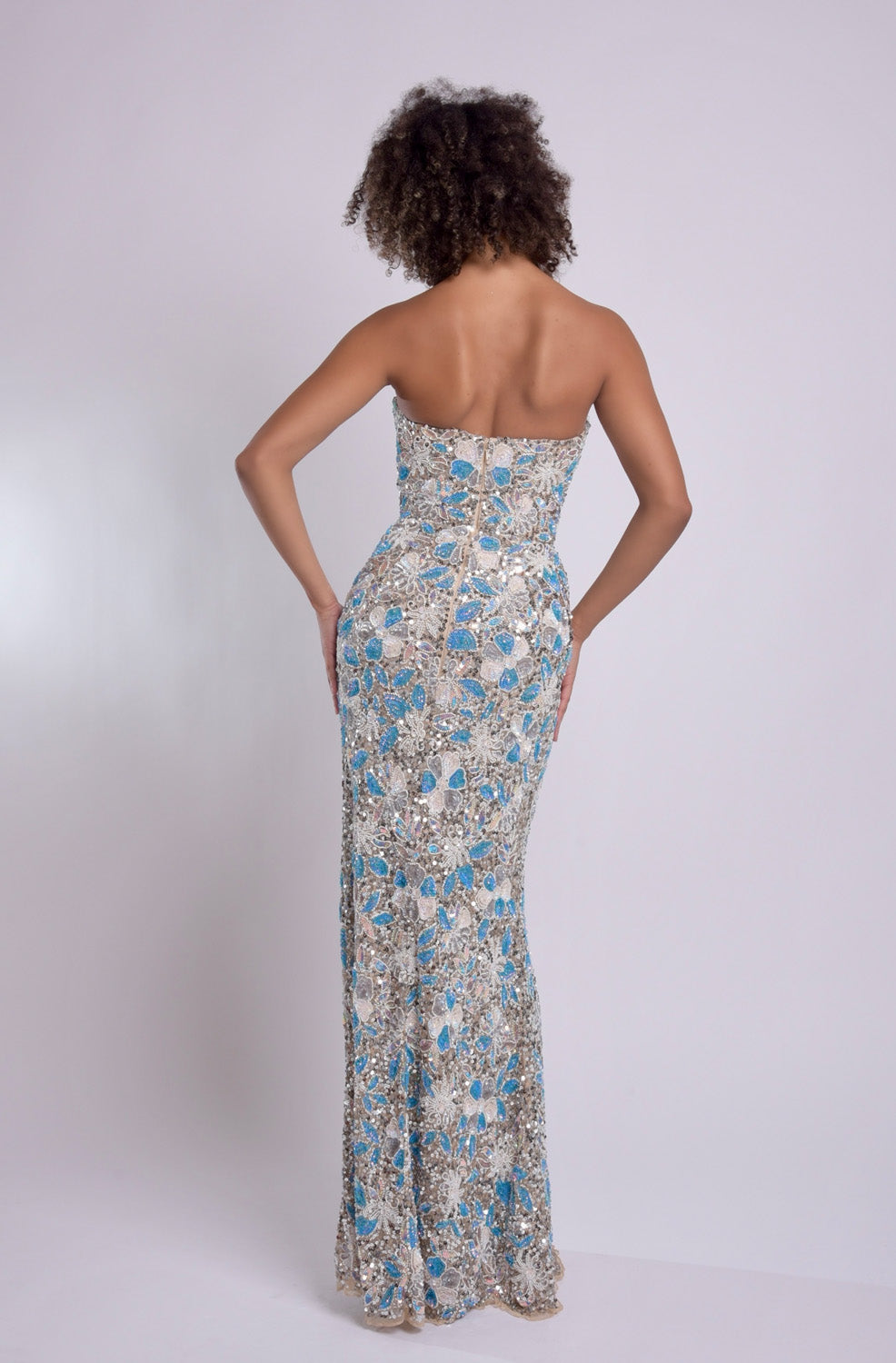 Jasz Couture 7971 Nude multi mermaid prom dress with intricate beading, back view.