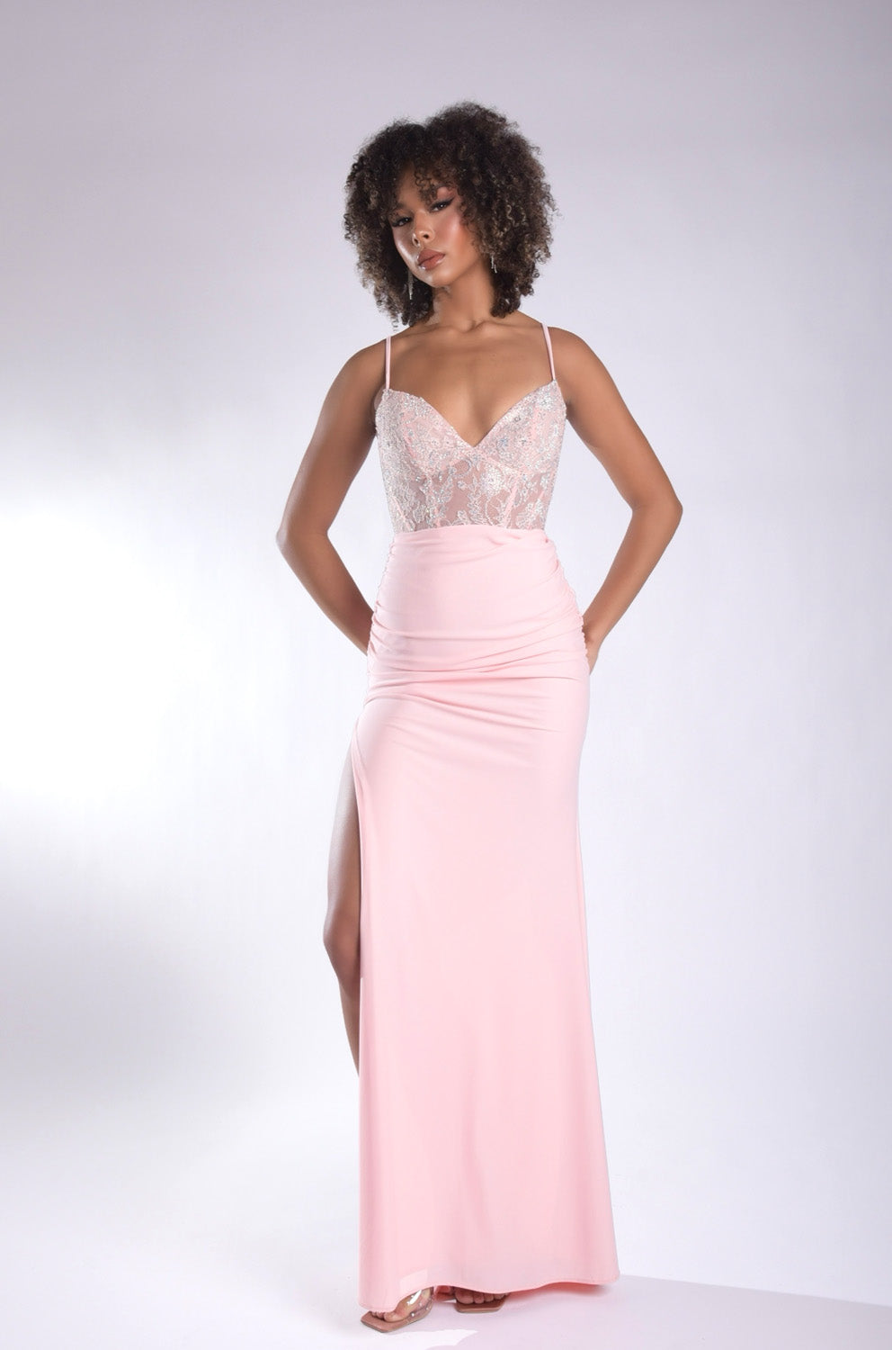 Jasz Couture 7986 Pink fitted prom dress with a thigh-high slit and lace bodice, front view.
