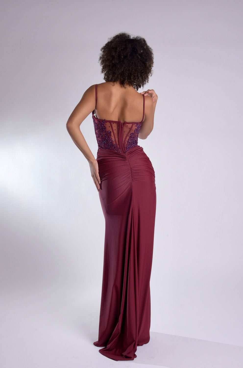 Jasz Couture 7988 Wine mermaid prom dress with lace-up back and elegant ruching, back view.
