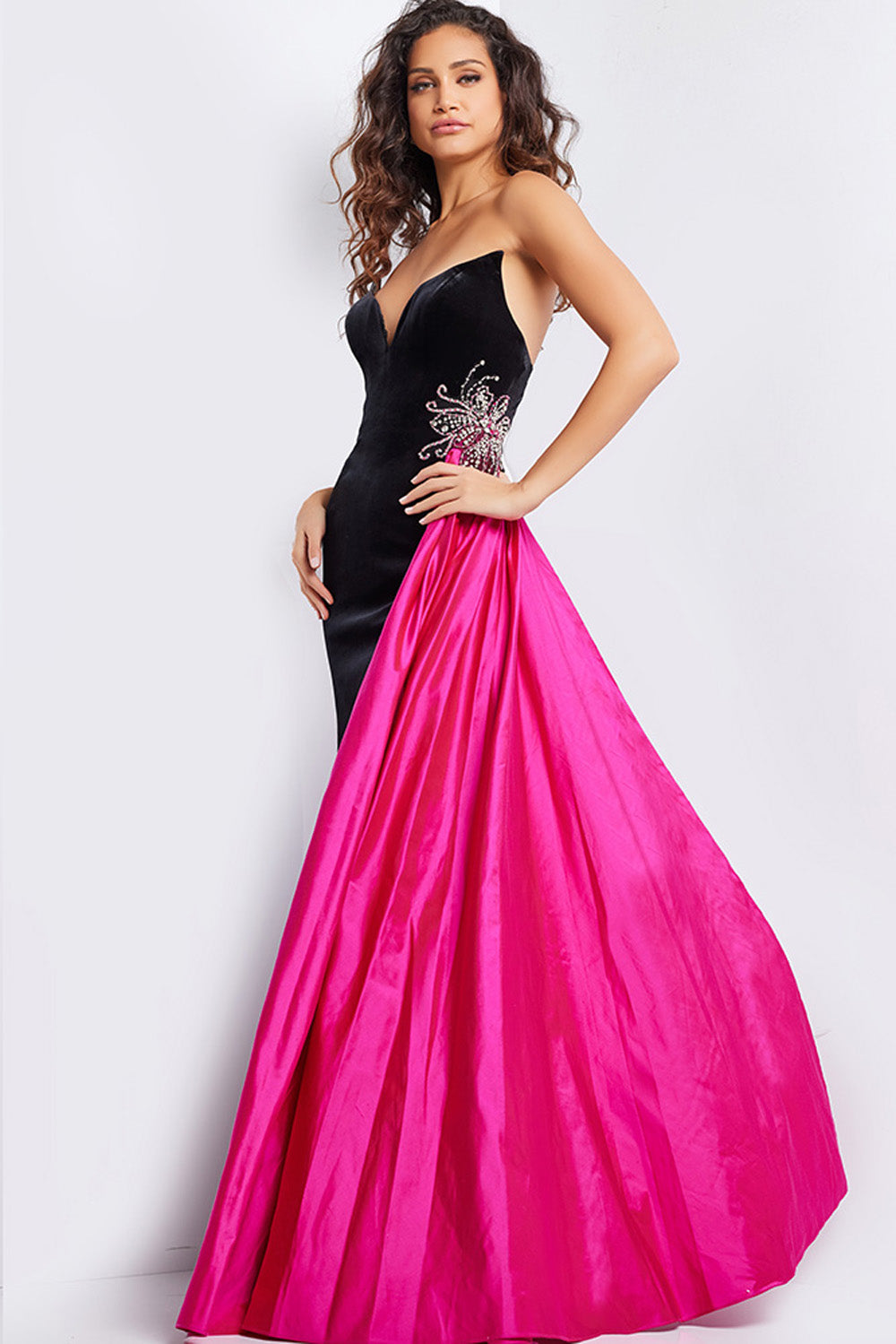 Jovani 26117 Black and fuchsia prom dress with a fitted silhouette and intricate beading detail.