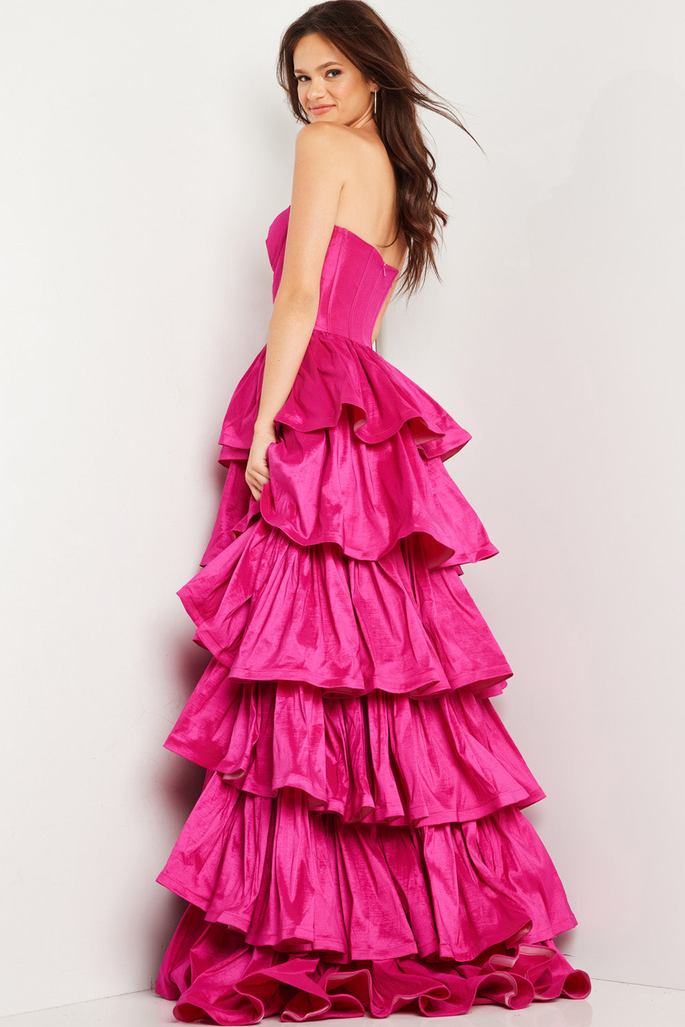 Jovani 36619 Fuchsia prom dress with layered ruffles and a fitted bodice, back view.