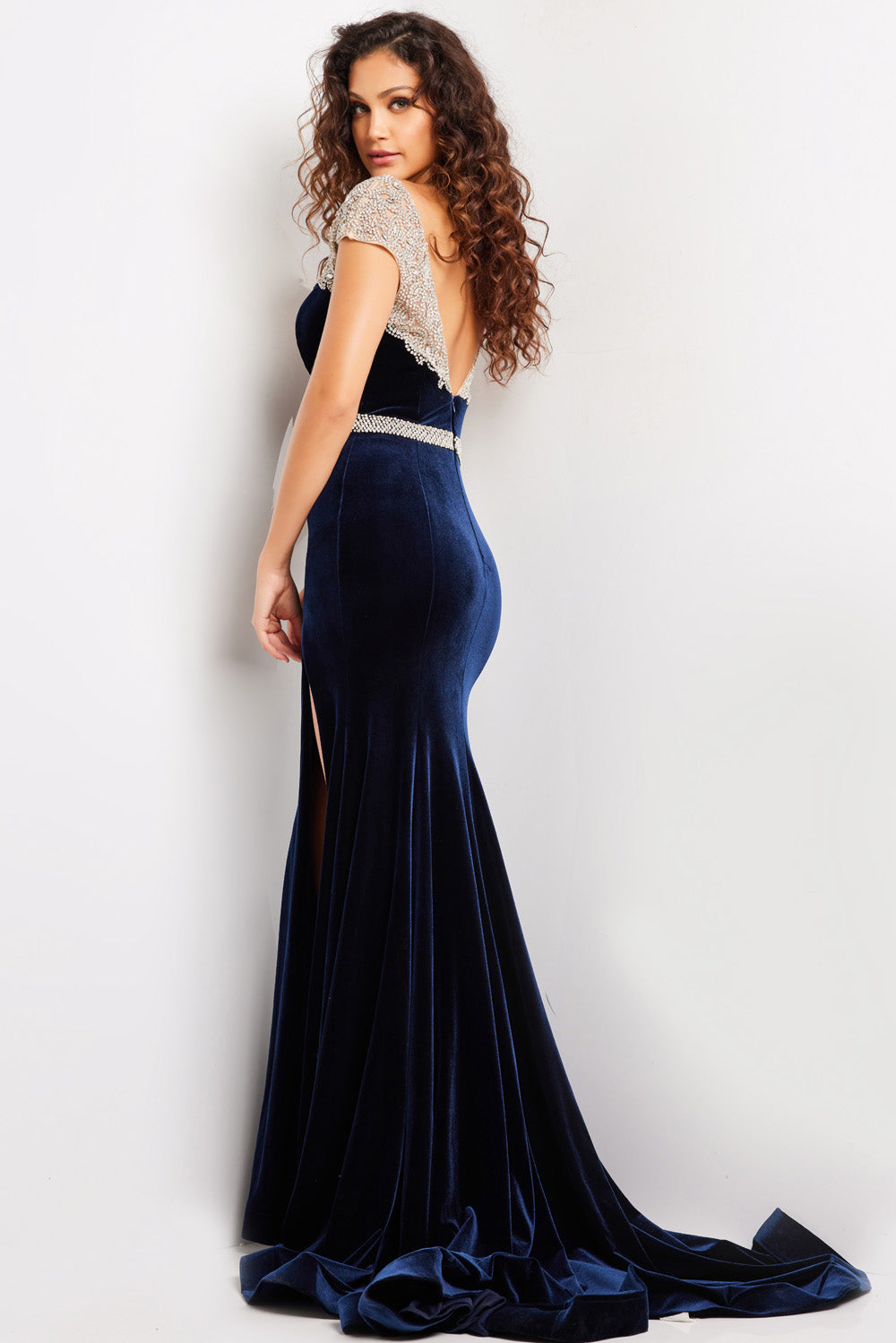 Jovani 37246 Navy mermaid prom dress with a high slit and embellished cap sleeves.