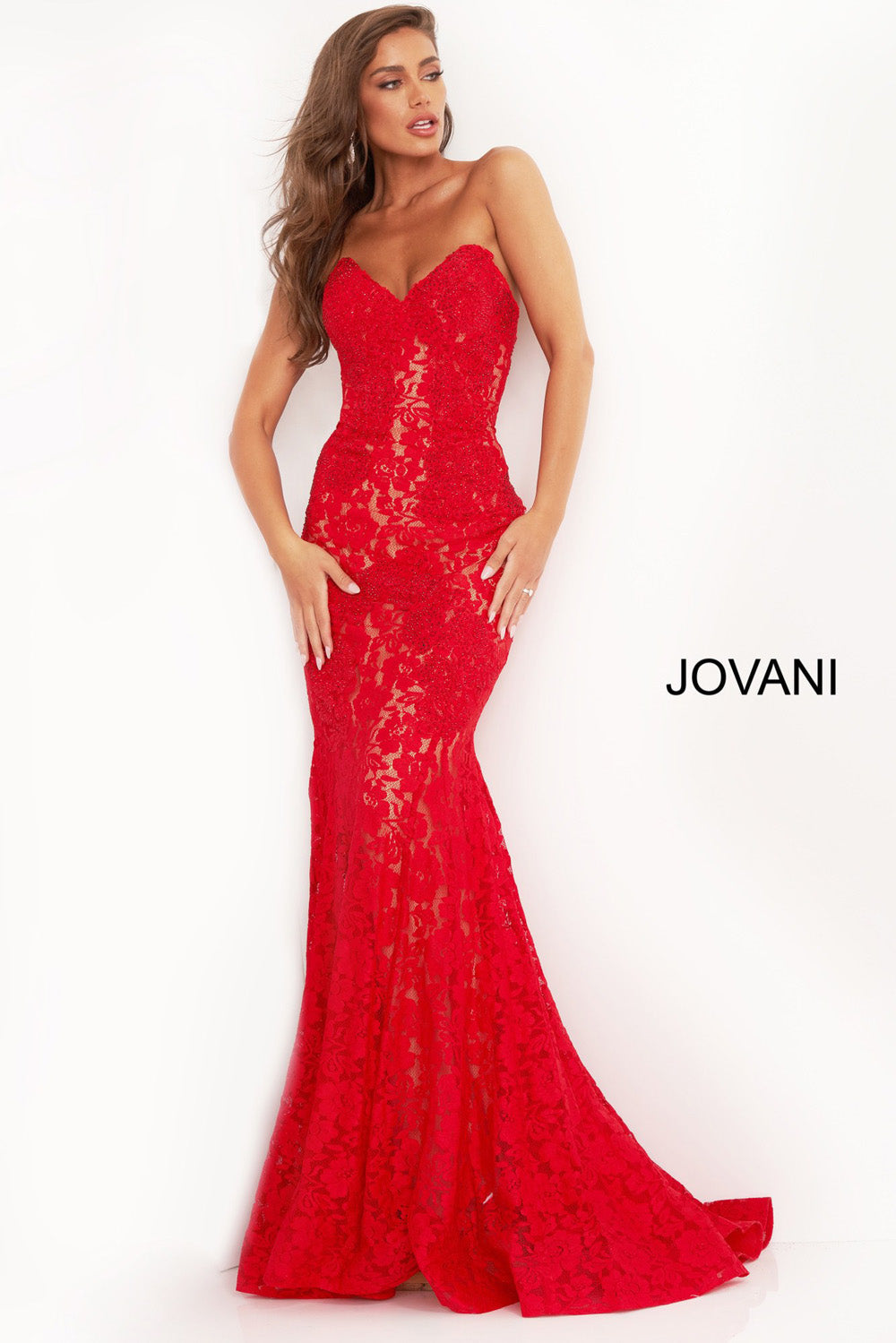 Jovani 37334 Red mermaid prom dress with intricate lace and a dramatic slit, front view.