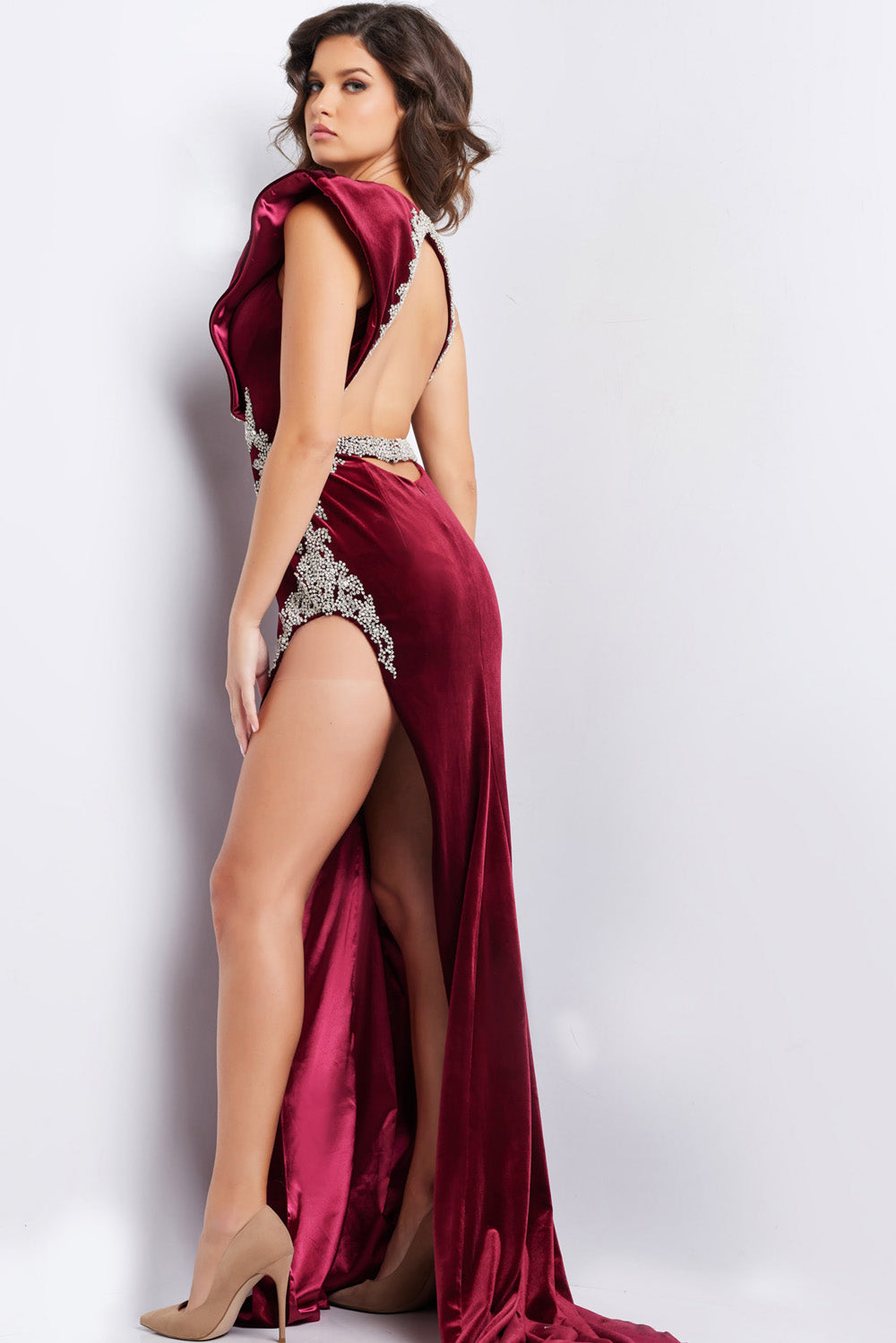 Jovani 37341 Burgundy mermaid prom dress with a high slit and intricate beading, back view.