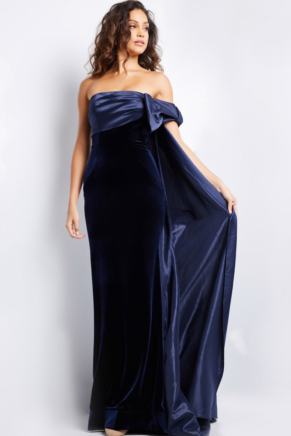 Jovani 37391 Navy fitted prom dress with a dramatic off-shoulder bow and side slit.
