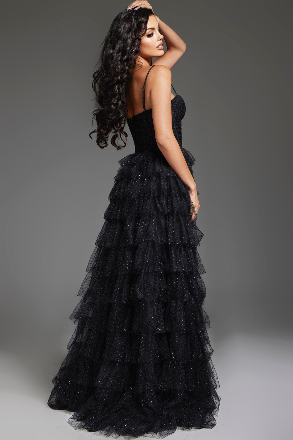 Jovani 38278 Black tiered prom dress with a fitted bodice and sparkling details, back view.