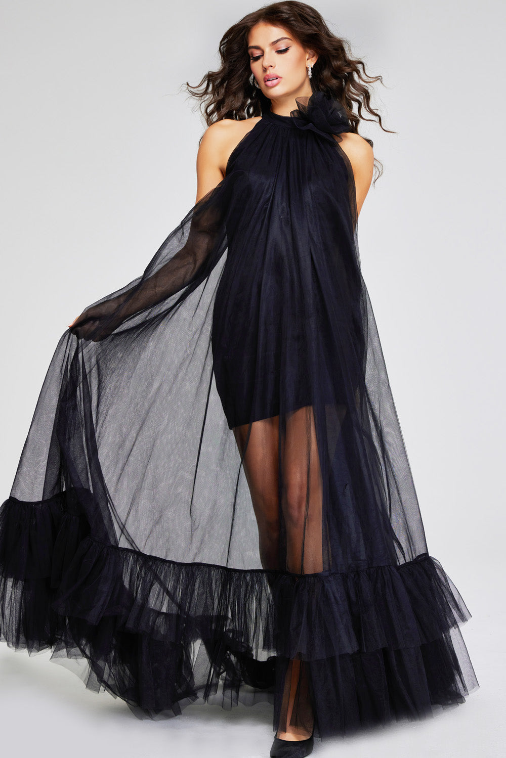 Jovani 38720 Black halter prom dress with sheer overlay and ruffled hem, featuring a side slit.