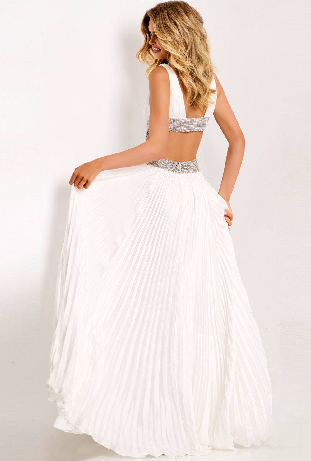 Jovani 42811 Off-white formal gown with pleated skirt and sparkling beaded back detail.