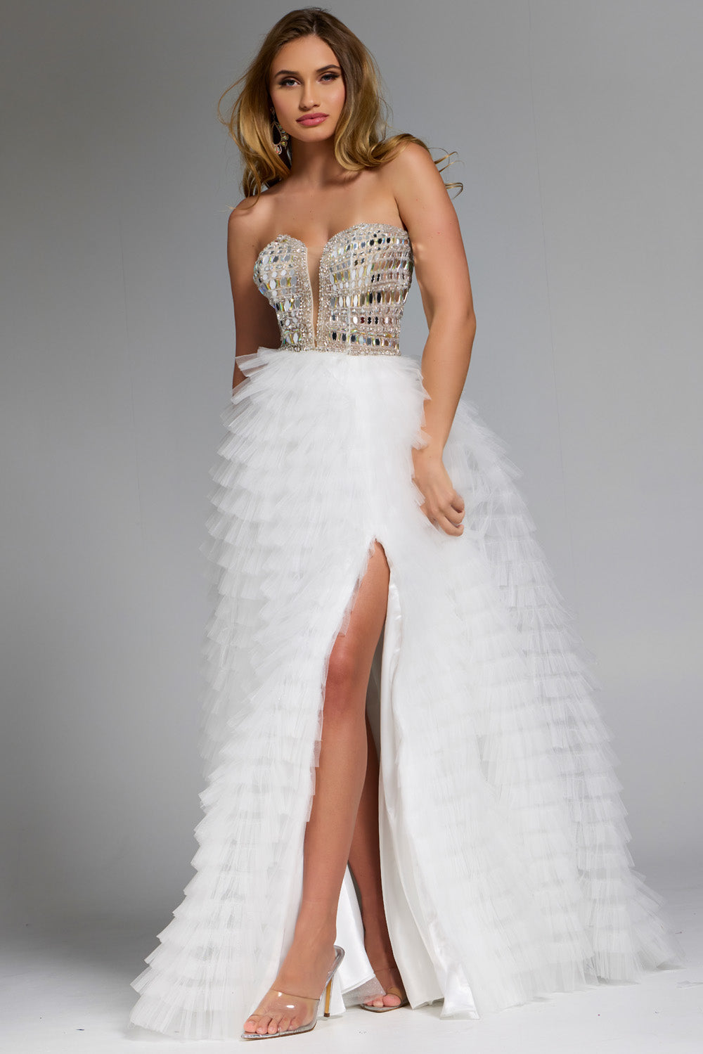 Jovani 43412 Off-white prom dress with a fitted bodice, beaded detail, and high slit.
