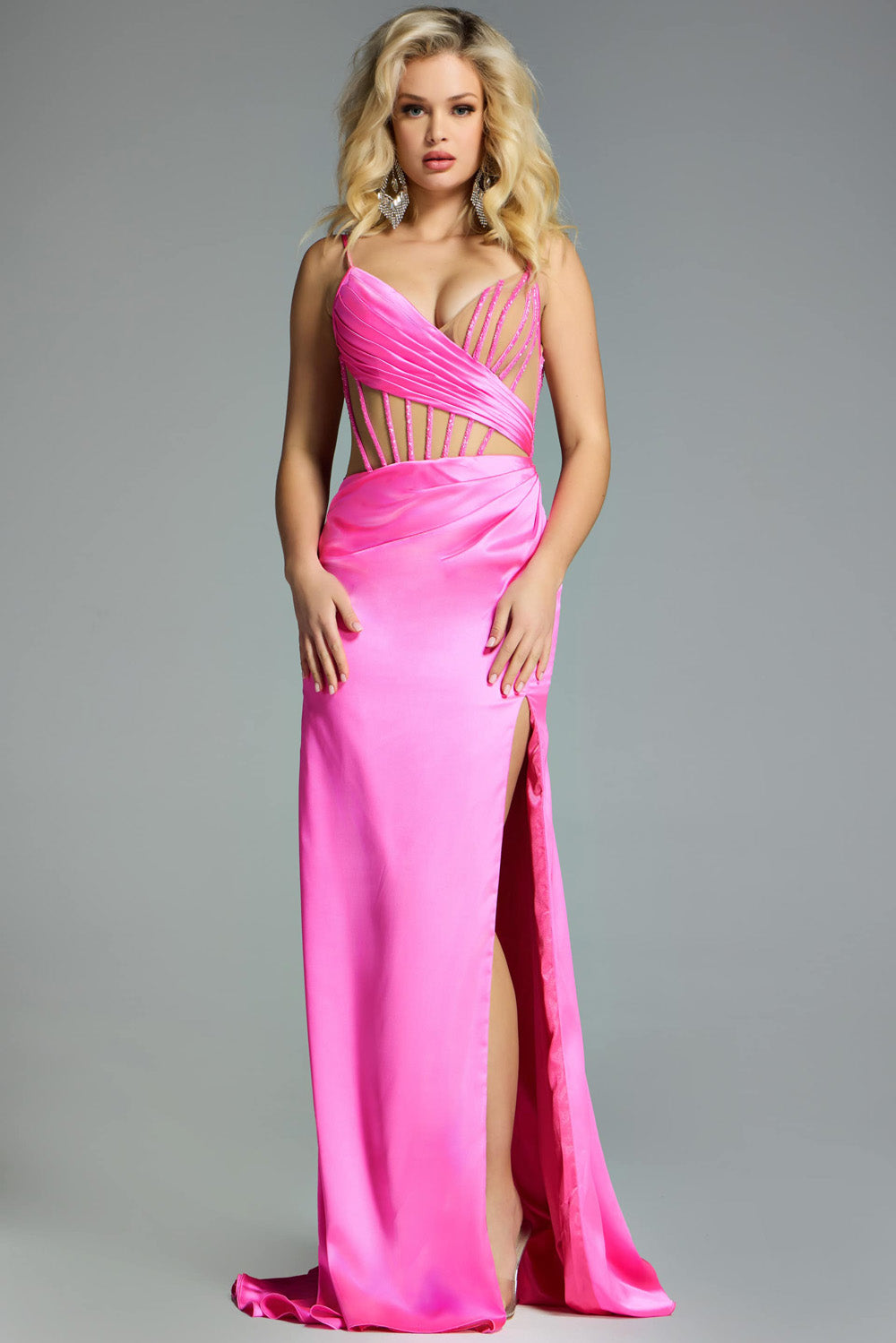 Jovani 43681 Hot pink fitted prom dress with a side slit and intricate beading details.