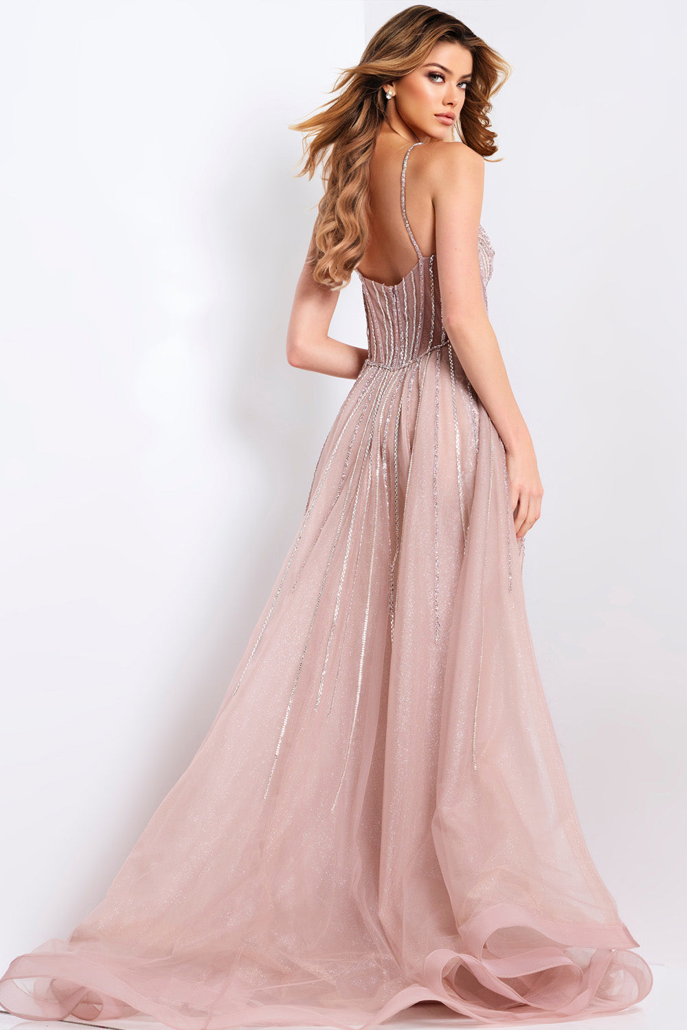 Jovani 43854 Rose champagne formal gown with a fitted silhouette and sparkling beading, back view.