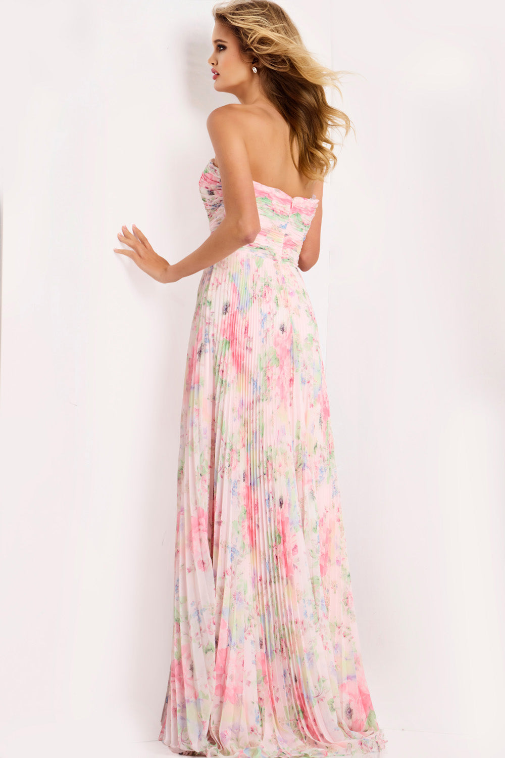 Jovani 44518 Pink floral prom dress with a pleated A-line silhouette and strapless design.