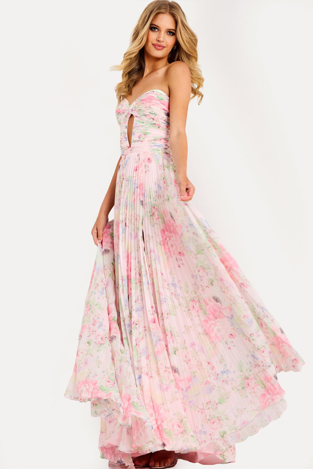 Jovani 44518 Pink floral prom dress with a fitted bodice and high slit, side view.