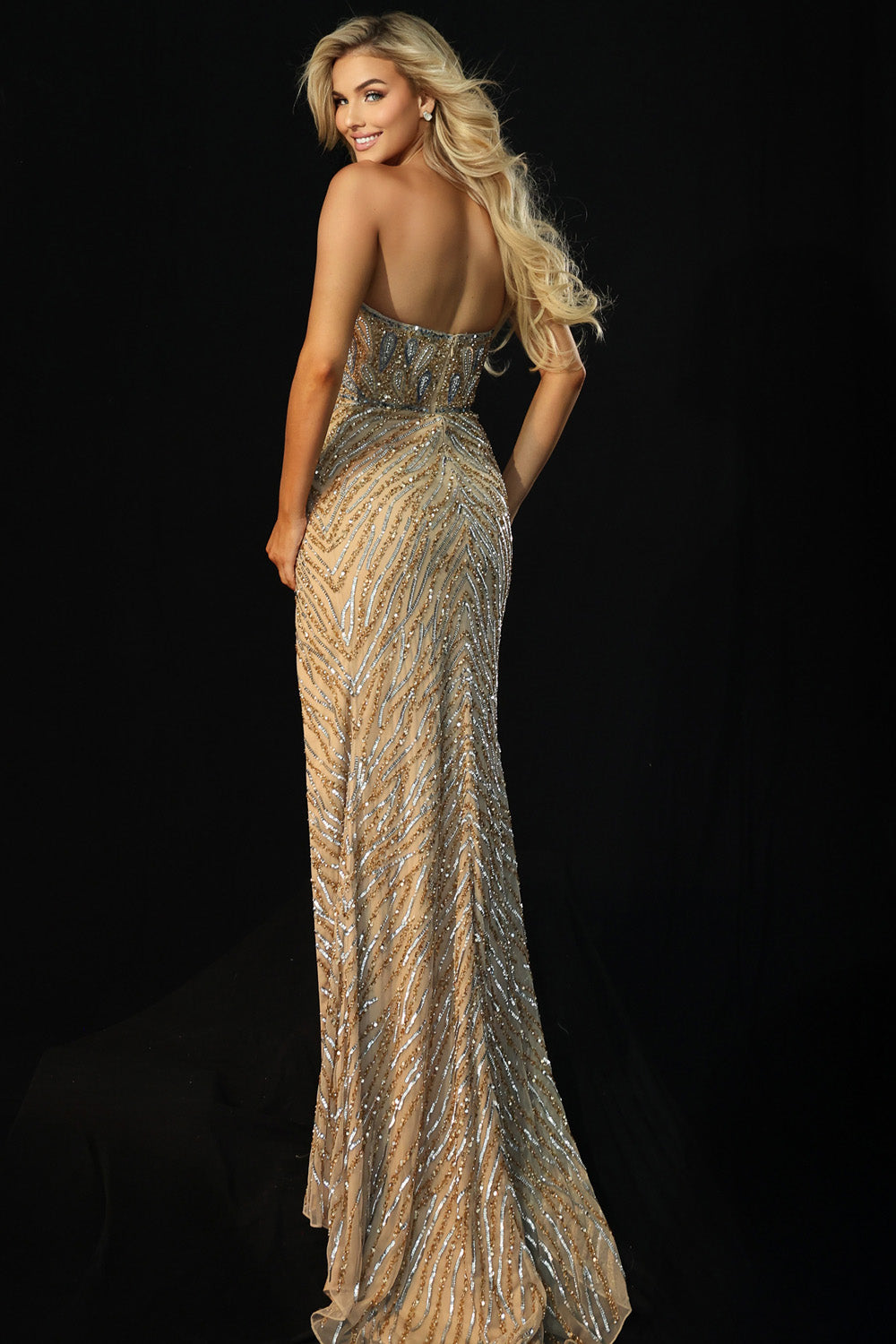 Jovani 46928 Nude formal gown with sequins and a fitted silhouette, back view.