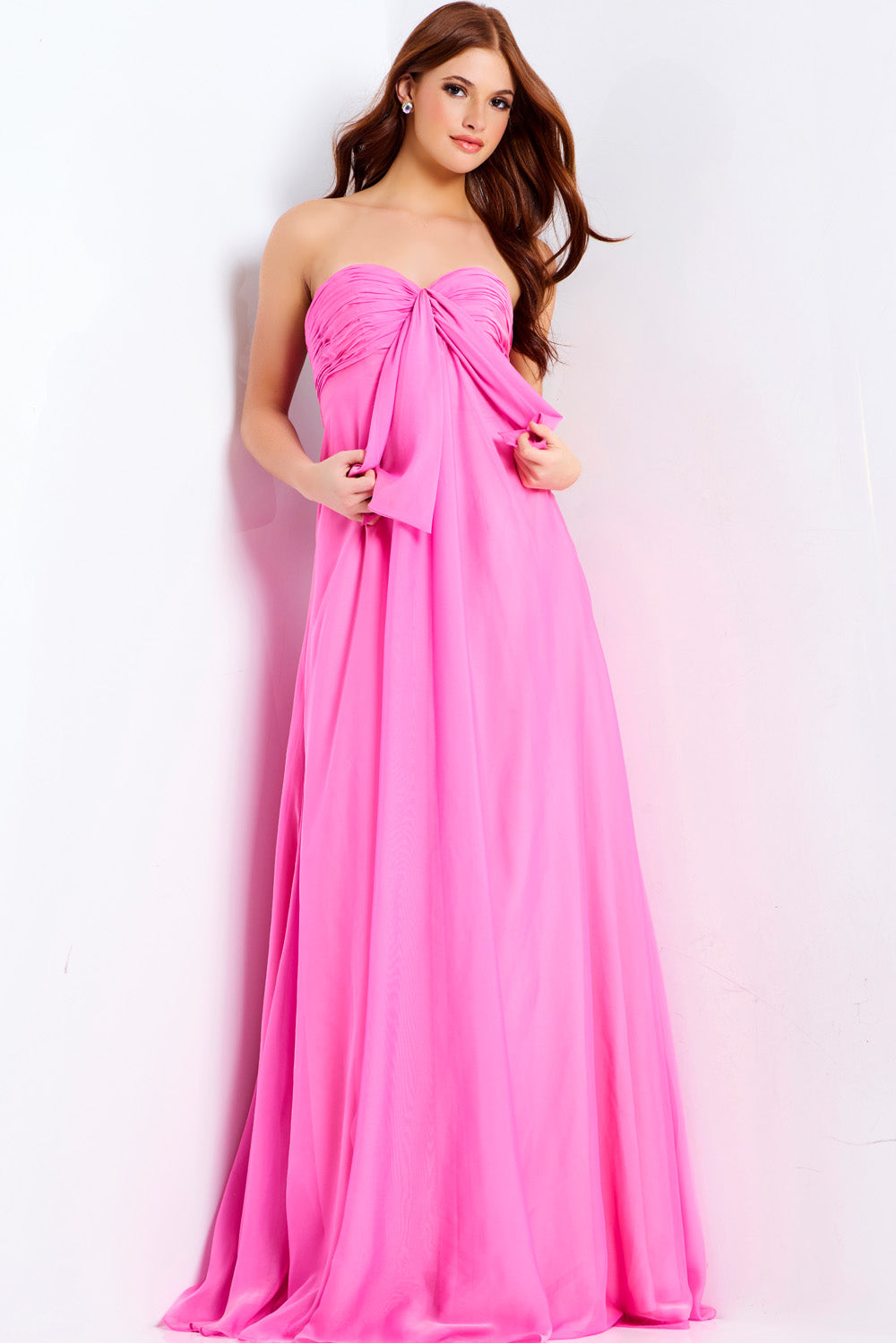 Jovani 47041 Hot pink strapless prom dress with a flowing silhouette and gathered bodice detail.