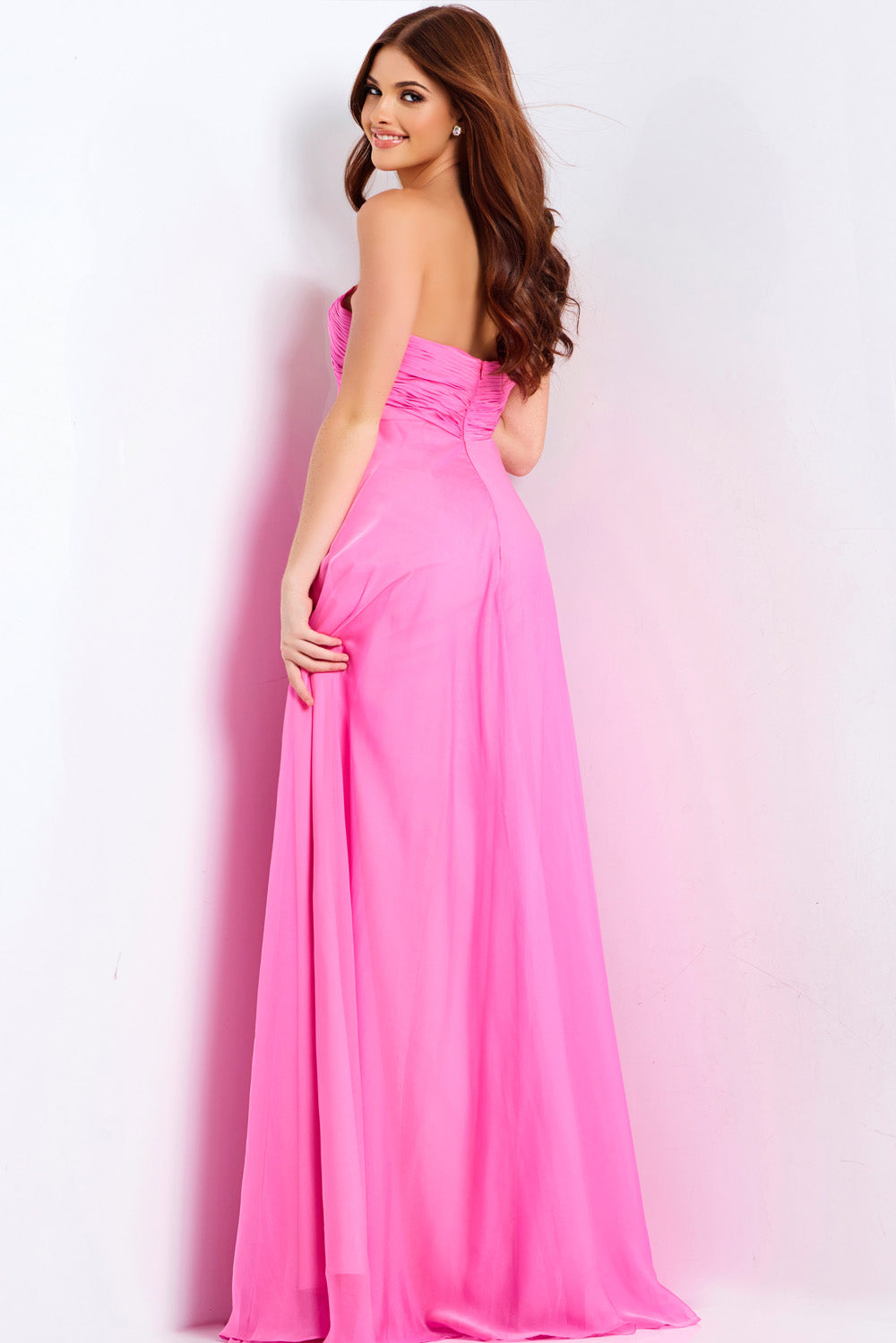Jovani 47041 Hot pink strapless prom dress with a flowing silhouette and ruched back detail.